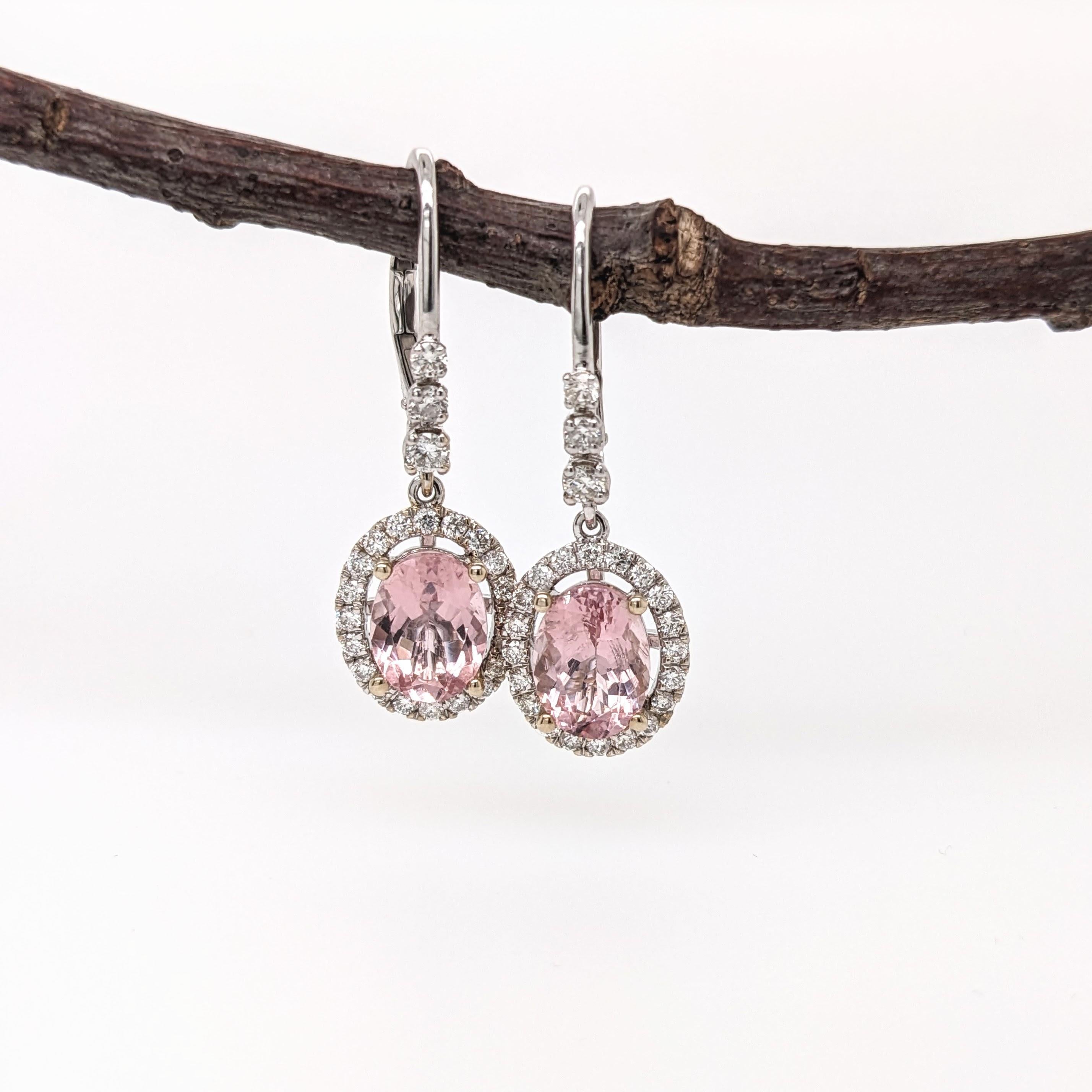 These beautiful drop earrings features two 2.52 cttw morganite oval gemstones with natural earth mined diamonds all set in solid 14k gold. A stunning pair of drop earrings which also make a beautiful June birthstone gift for your loved