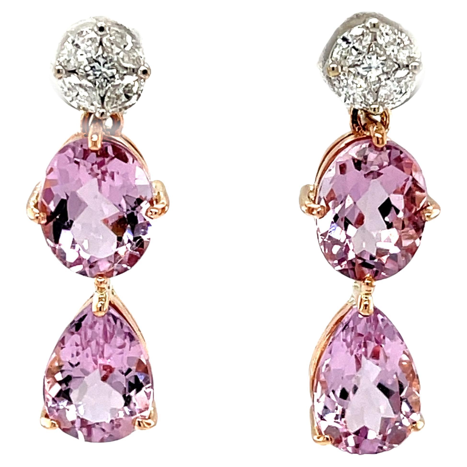 These gorgeous two-toned drop earrings feature over 7 carats of sparkling pink morganite in two shapes, dangling from brilliant white diamond tops set in 18k gold! The perfectly matched, crystalline gem morganites have beautiful, bright pink color