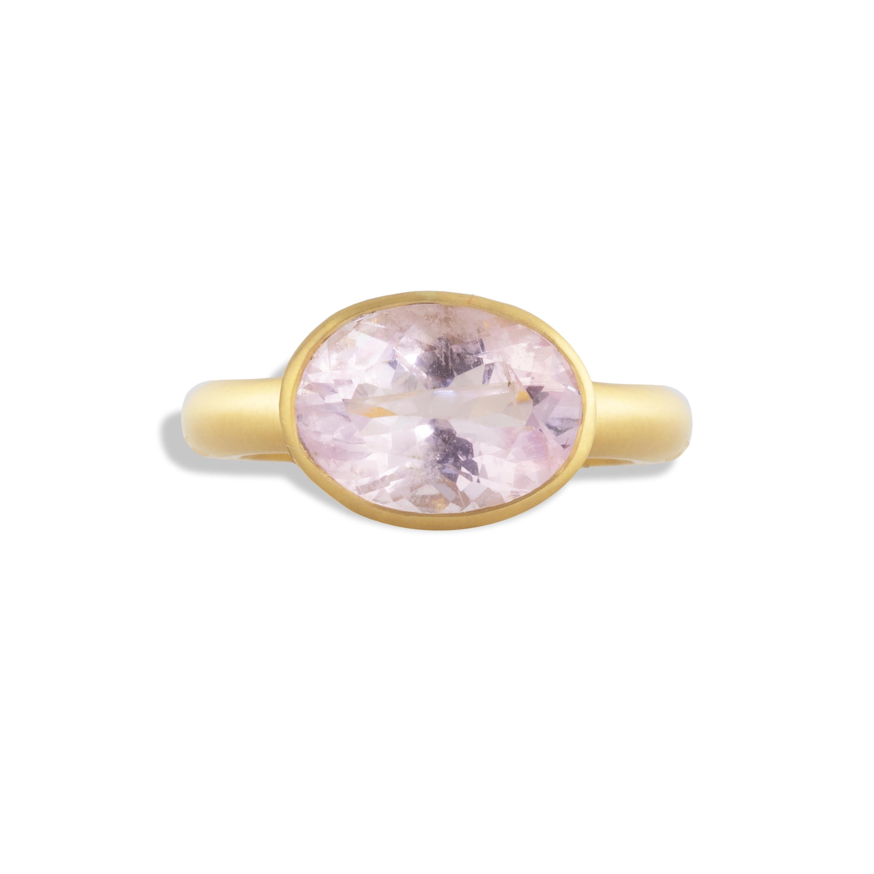 A dreamy, soft stand-out 3.52 carat Morganite oval gemstone, framed in a hand-made setting framed with jali work and set in 18k matte yellow gold.  The soft pink Beryl, also known as  'pink emerald,' peeks through the Jali wave cut-outs along the