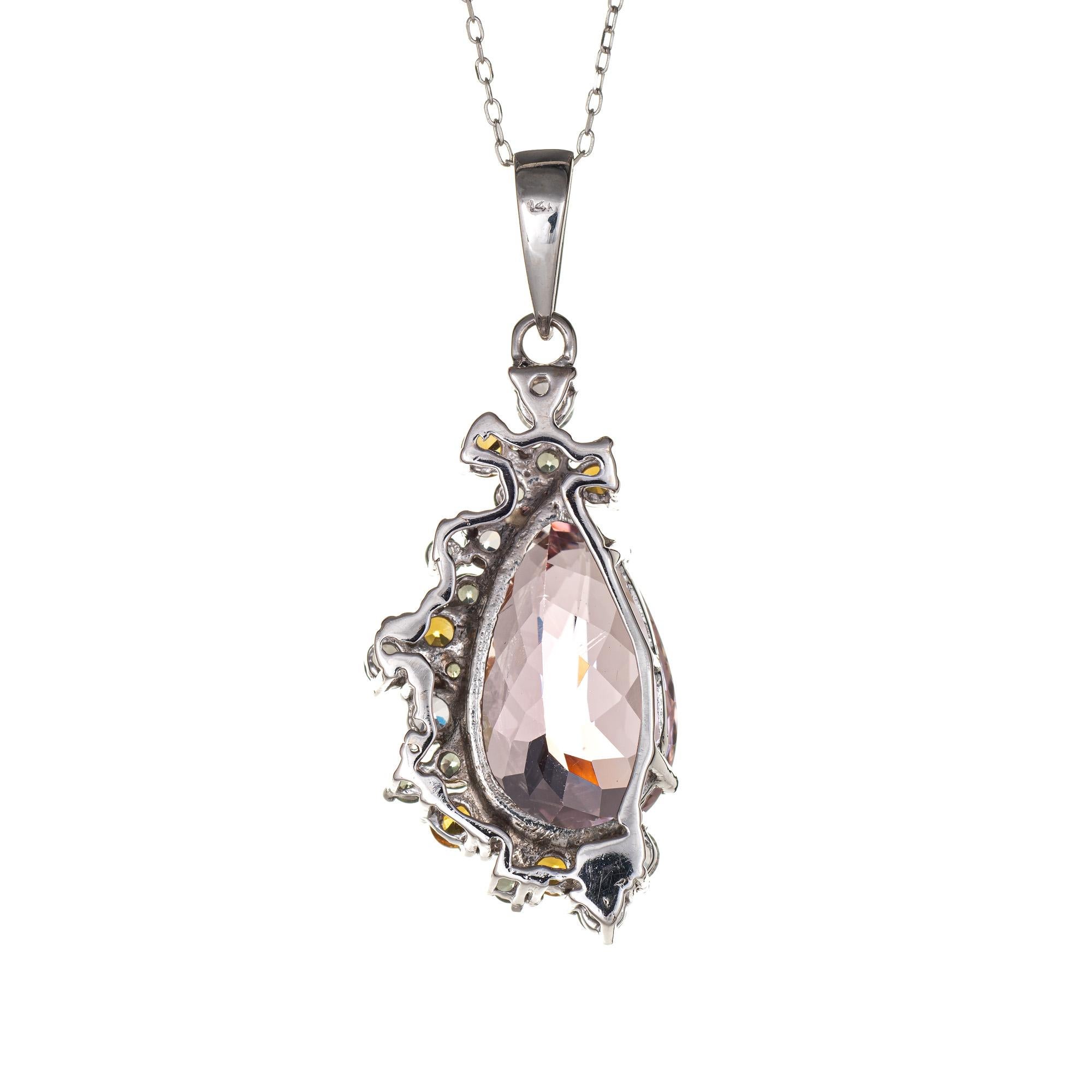 Finely detailed morganite & multi gemstone necklace crafted in 14 karat white gold. 

Pear cut faceted morganite measures 20mm x 12mm (estimated at 11 carats). Citrine, prasiolite and white topaz total an estimated 2.25 carats. The stones are in