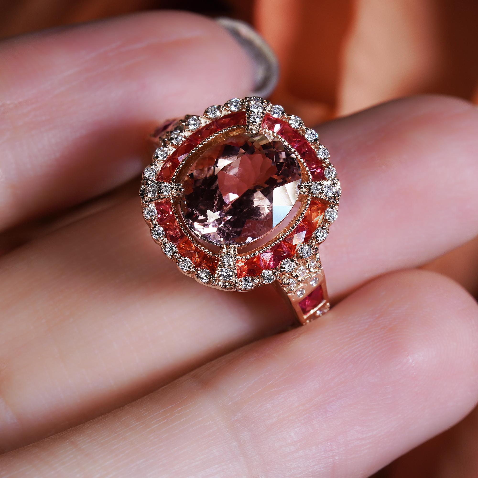 This stylish 2.44 ct. Oval Morganite with Orange Sapphire and Diamond in 14K Rose Gold Ring will lend an eye-catching touch of sparkle to your look. Crafted in lustrous rose gold, the ring features an oval-cut morganite gemstone surrounded with