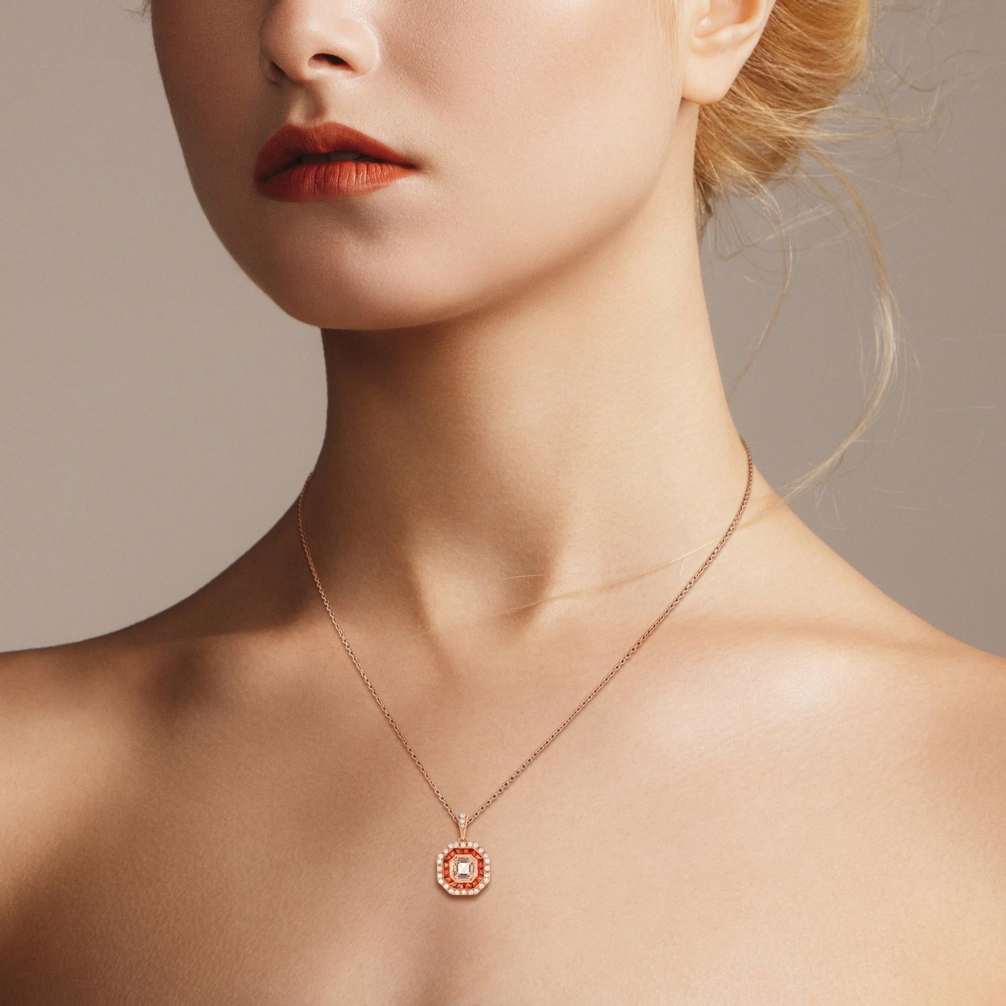 This morganite with orange sapphire and diamond pendant presents a stunning example of Art Deco styling and design. Emerald cut pale peach color morganite, French cut orange sapphire, and round cut diamond are precisely arranged to create intricate