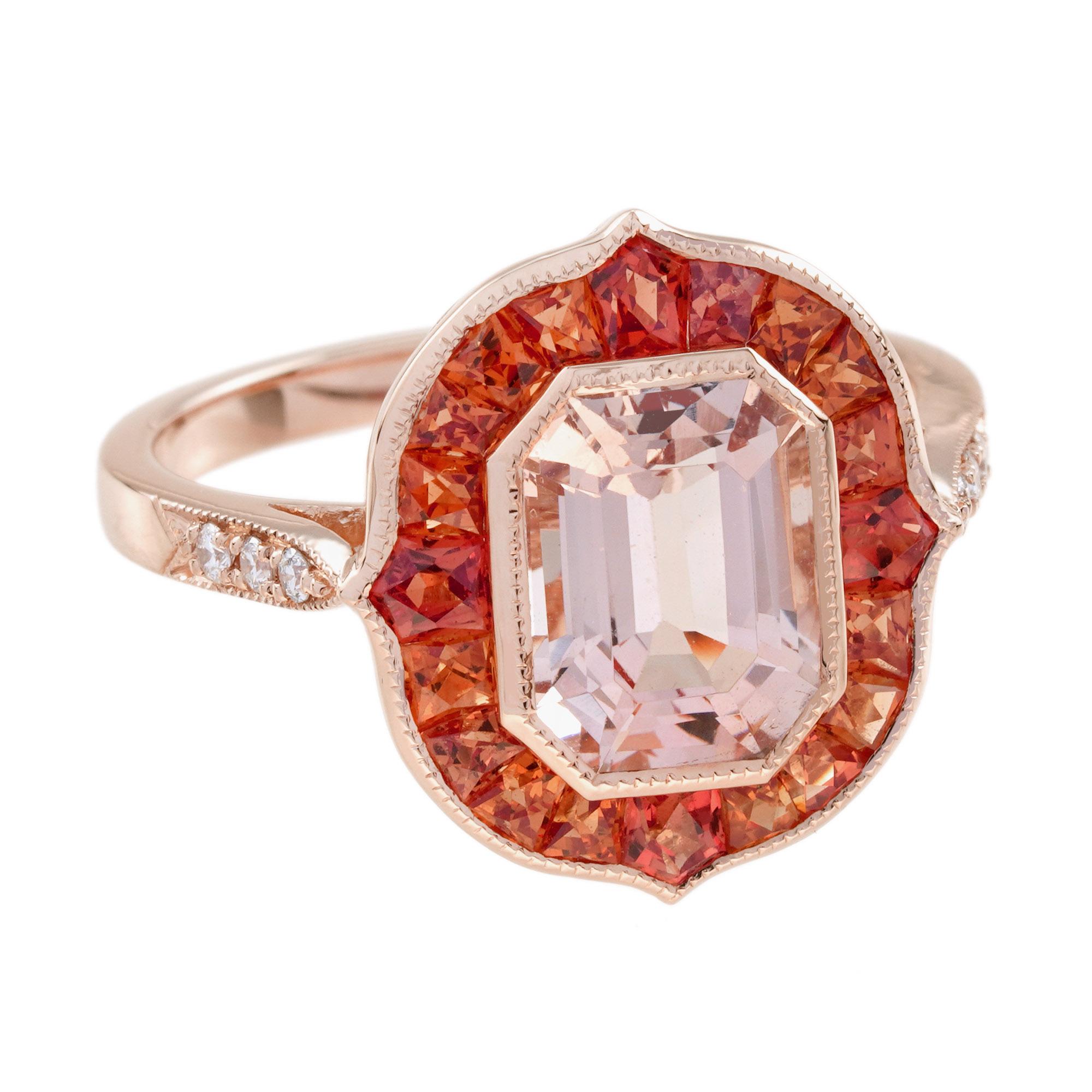 Featuring a premium morganite center, it's beautifully framed by vibrant orange sapphires that radiate warmth. Sparkling diamonds along the shoulders add brilliance and sophistication. Crafted for those who cherish bold vintage charm with modern