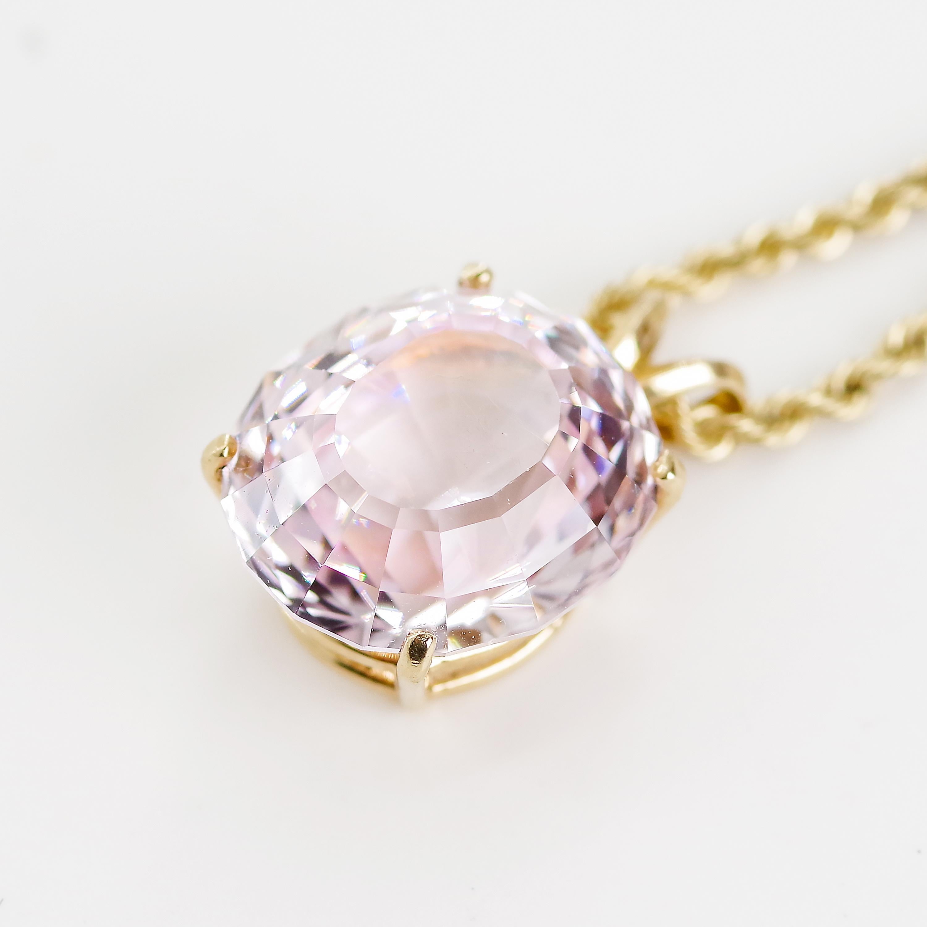 This is 14.5 carats of deep, faceted oval violet-pink Morganite. Do we all know the story of Morganite? In case we don't, here goes: Morganite is the same mineral as emerald and aquamarine -beryl- but when it comes in pink to orange-pink it’s called