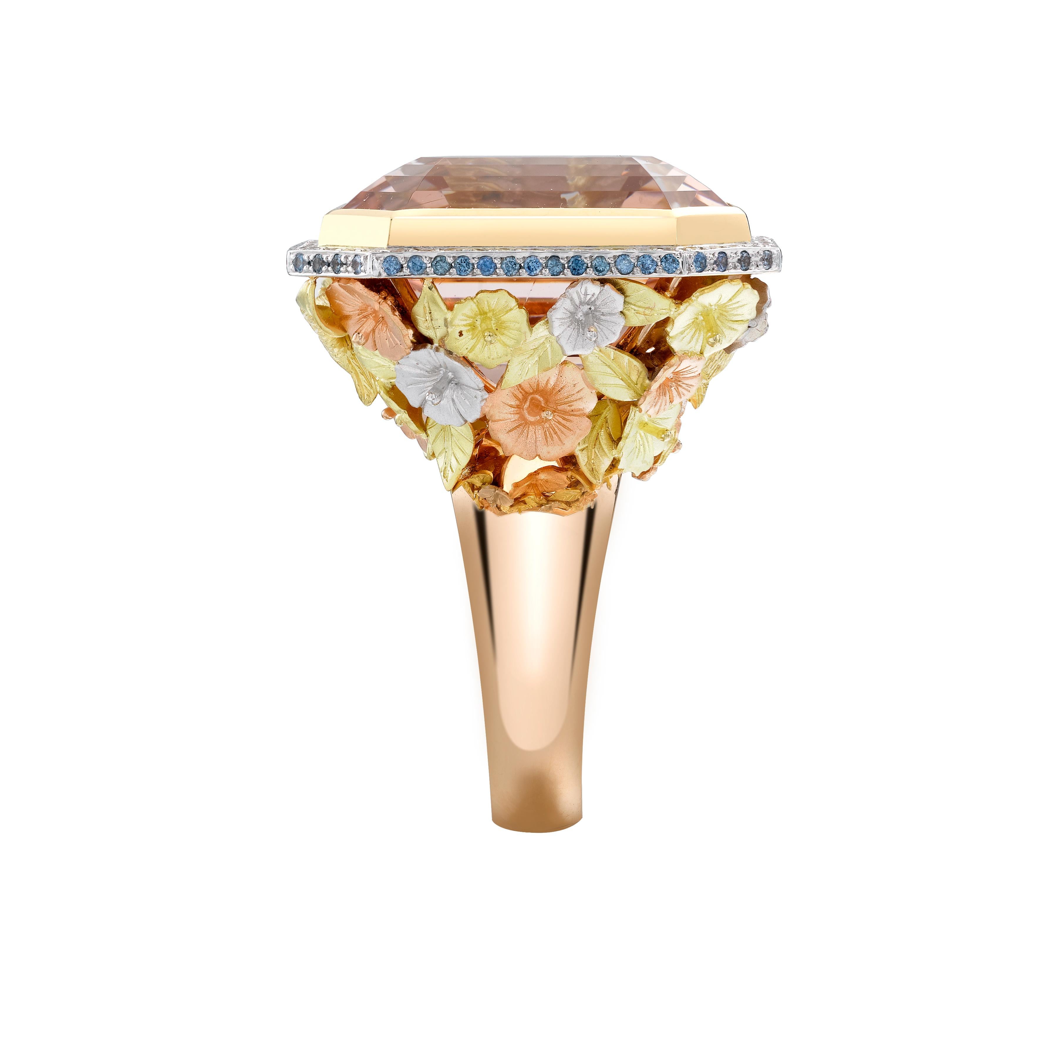 Theo Fennell's Hummingbird and Blossom ring is a beautiful example of the perfect harmony between design and craftsmanship, elegant and thoughtful. The finely detailed yellow, white and rose gold hibiscus flowers climb around the 46.99ct Morganite