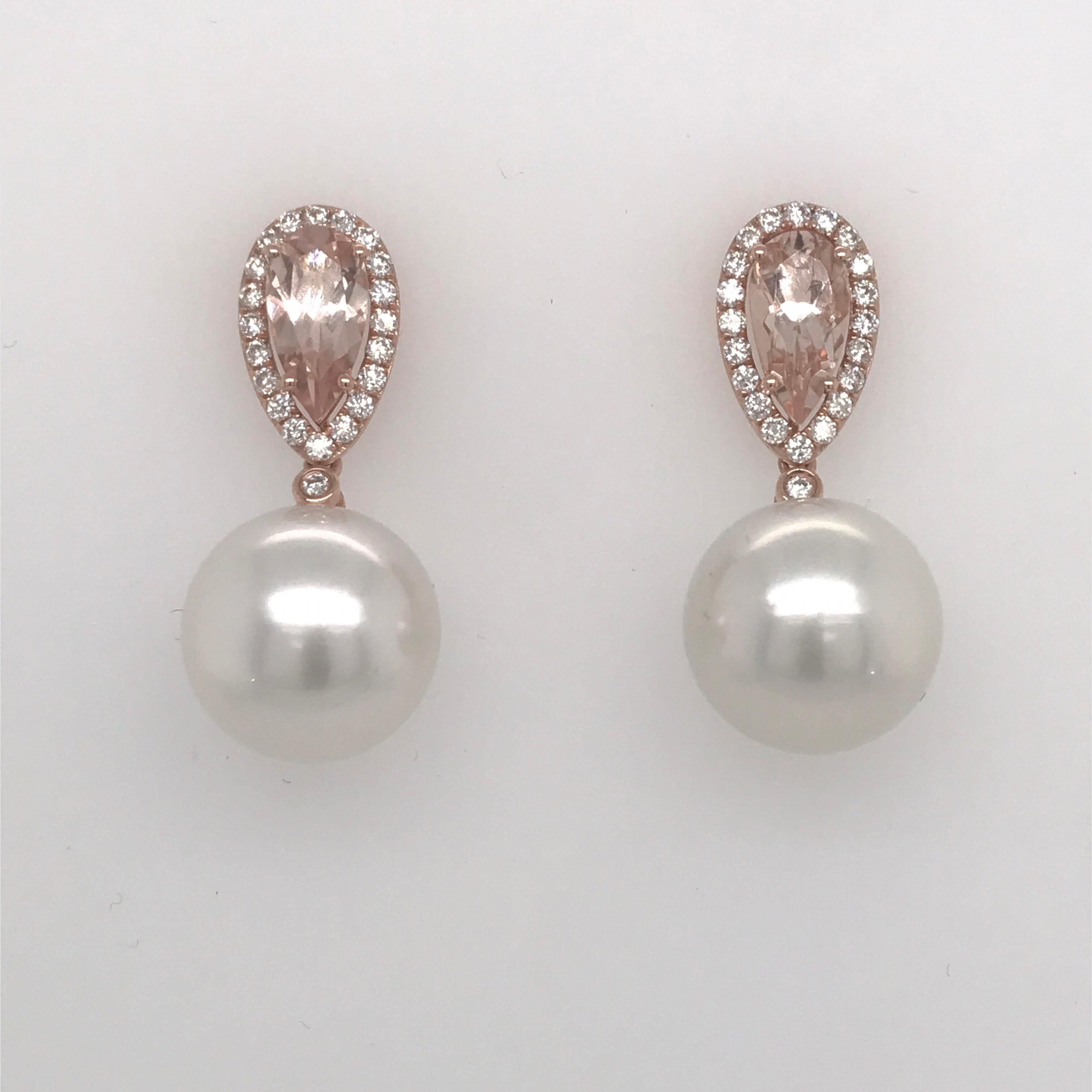 18K Rose gold drop earrings featuring two morganites weighing 2.03 carats surrounded by round brilliants weighing 0.50 carats and two south sea pearls measuring 12-13mm. 