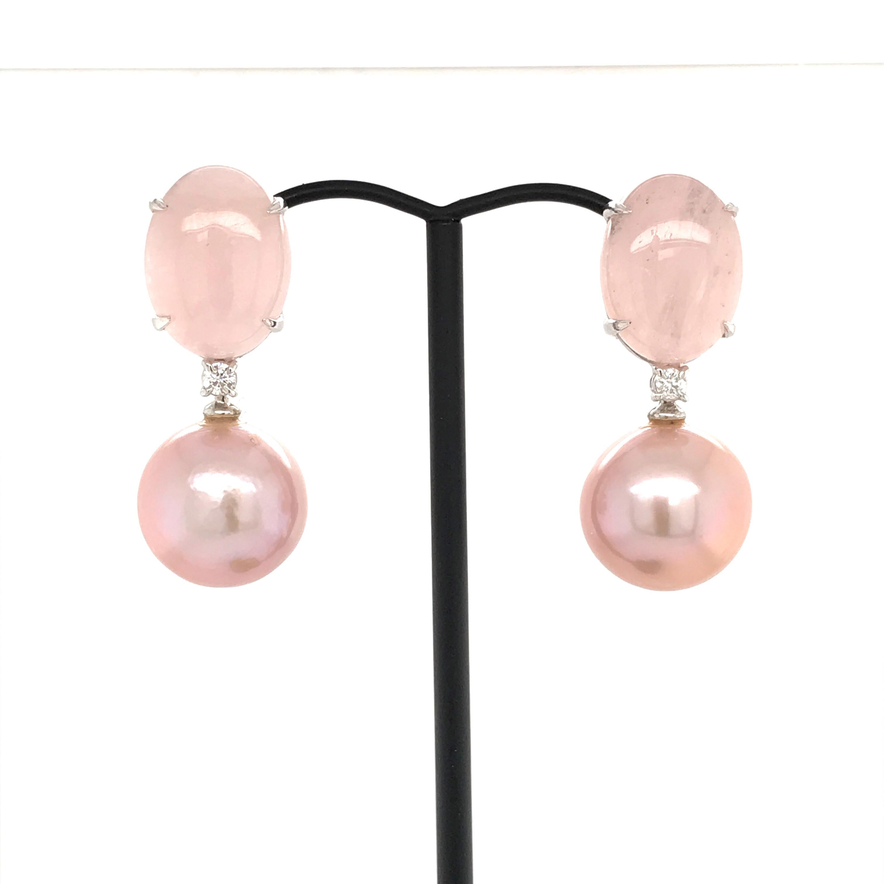 Discover this Cultured Perles pink with 
Natural Morganite
2 White Diamonds shape B 0.140 carat 
White Gold 18K weight 4.25 grams
2 type of Claps   
Chandelier Earrings
Can be adapted to ear not pierced
