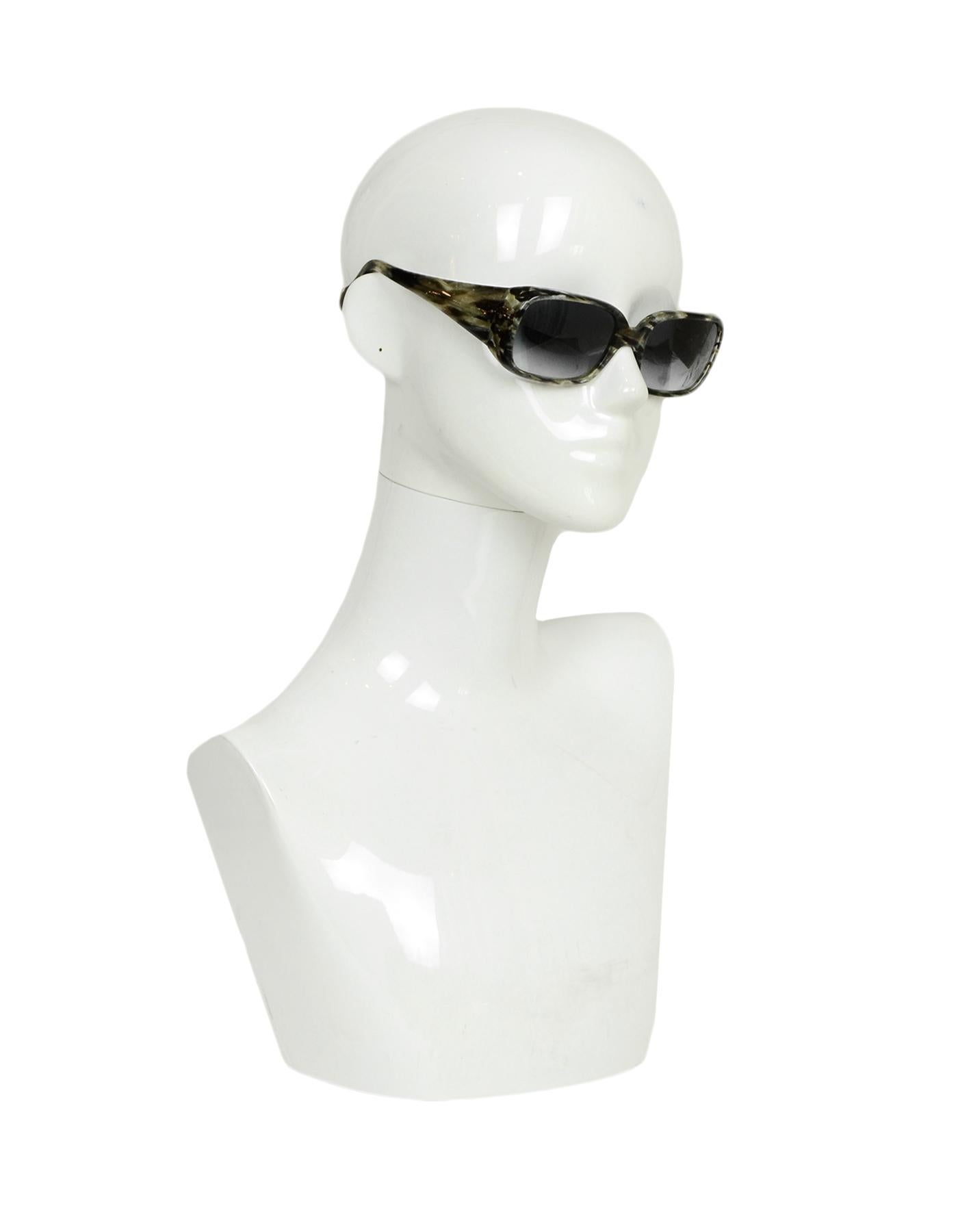 Morgenthal Frederics Grey Tortoise Elektra XL Sunglasses

Made In: France
Color: Grey
Hardware: Silvertone
Materials: Metal, Plastic
Overall Condition: Very good pre-owned condition, minor wear on the front

Measurements: 
Length Across Front: