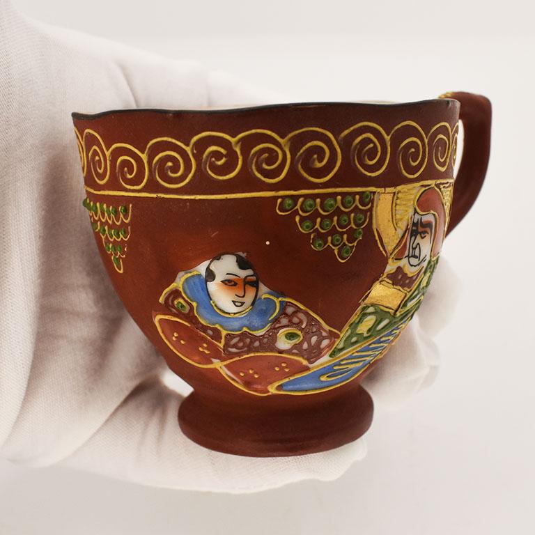 Japanese Moriage Figural Porcelain Teacup and Saucer in in Maroon and Gold, Japan For Sale