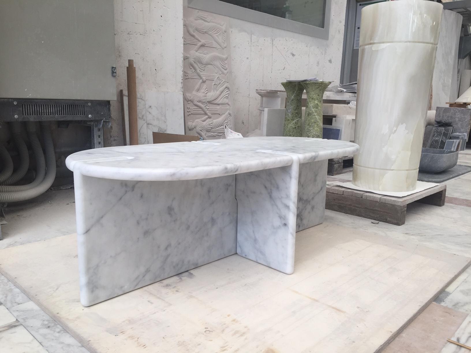 Morini table in Bianco Carrara honed with full bull nose designed by INC Architecture & Design. Top in Bianco Carrara with honed finish and full bullnose. Also available in Calacatta and Nero Marquina. 

- Top dimensions: 3 in. thick. 
- Overall