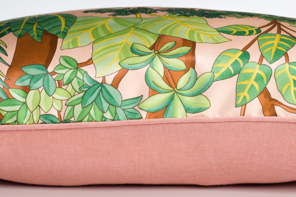 Morny Pêche Pink and Green Floral Printed Silk Pillow/Cushion: Introduce the allure of the exotic into your cushion collection with this tropical garden print on a cotton satin ground. The linen peach backing finishes it off. It's a piece you'll