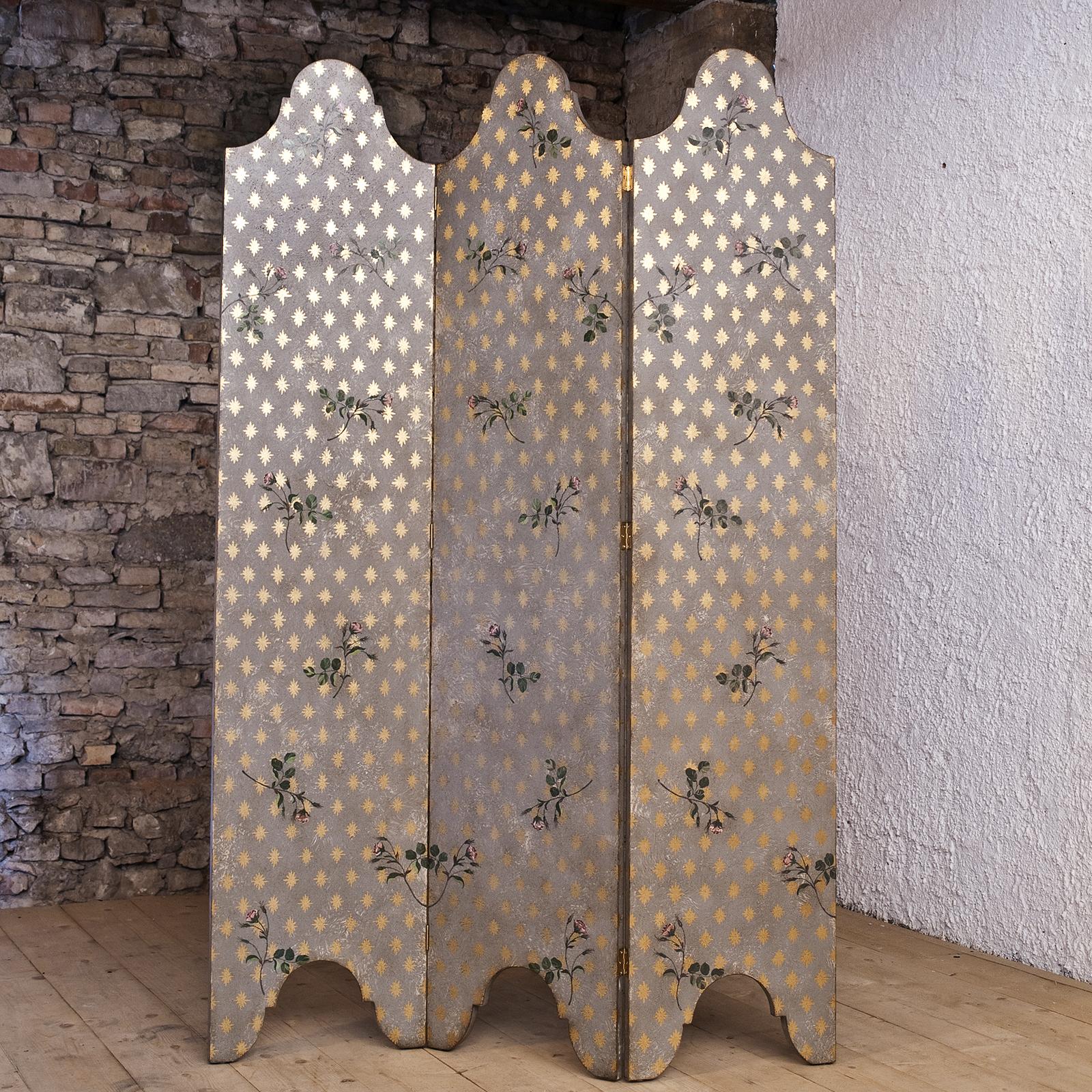 This charming screen is crafted of wood with a vintage appeal that will complement both classic or modern decor where it can be used as a room divider or purely decorative focal point. The graceful arches of the three hinged panels evoke the image