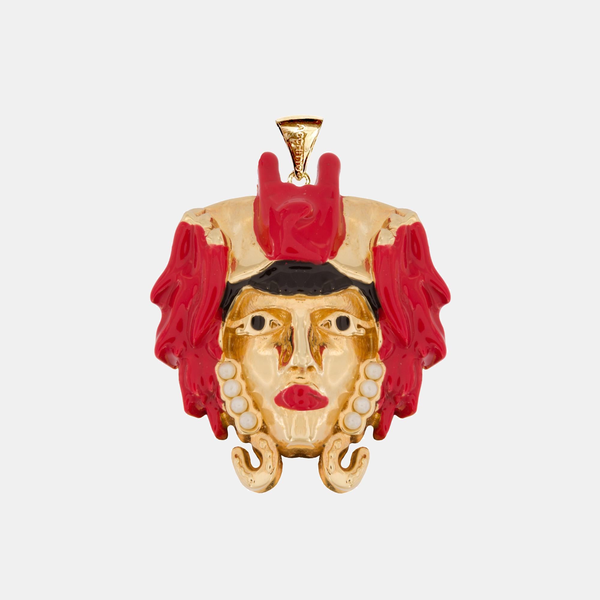 The Moro Iconic Pendant Fortunato Red made of 18K gold plated brass and embellished with Swarovski crystals and colored enamels, can be worn in different ways: it can be matched with Acchitto Stilla drop earrings, Acchitto Aurea necklaces, but also