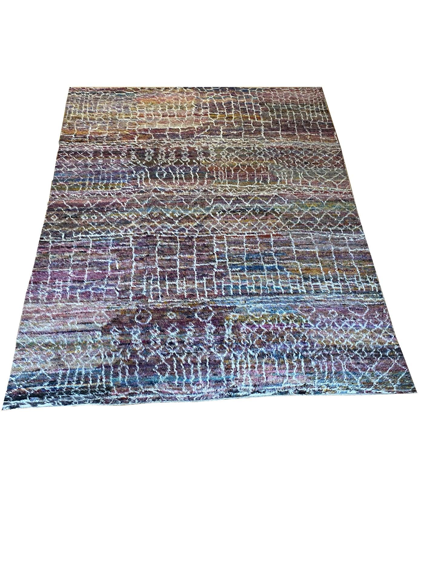 Jewel toned plush shaggy Moroccan rug with lattice, zig zag, and linear patterns.

9′ x 11’9″

 

14686

 

The early adoption of rug-making by native Moroccans is certainly due in large part to the distinctive climate of the region: Moroccan rugs