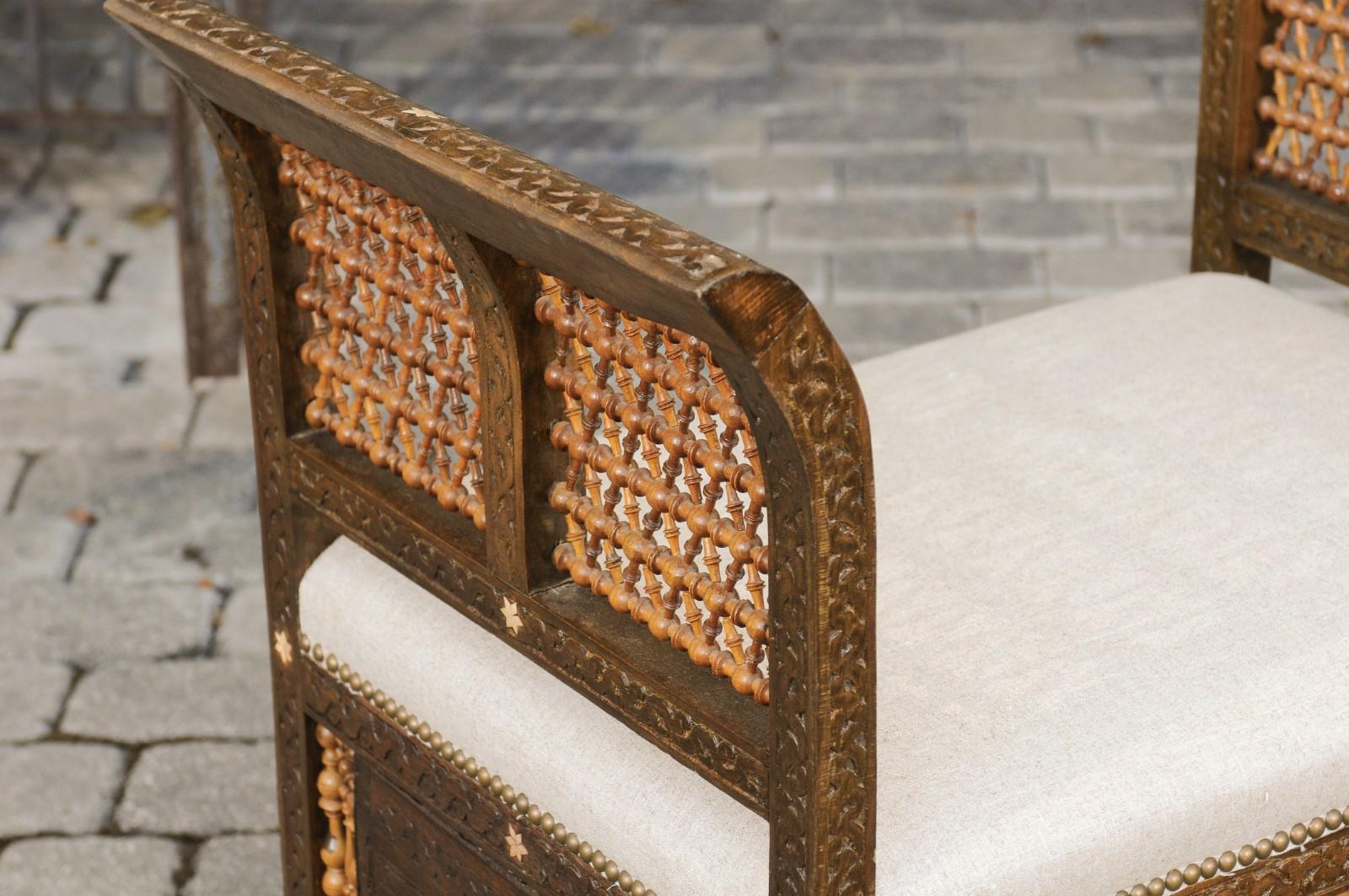 20th Century Moroccan 1900s Carved Two-Toned Wooden Upholstered Bench with Out-Scrolling Arms