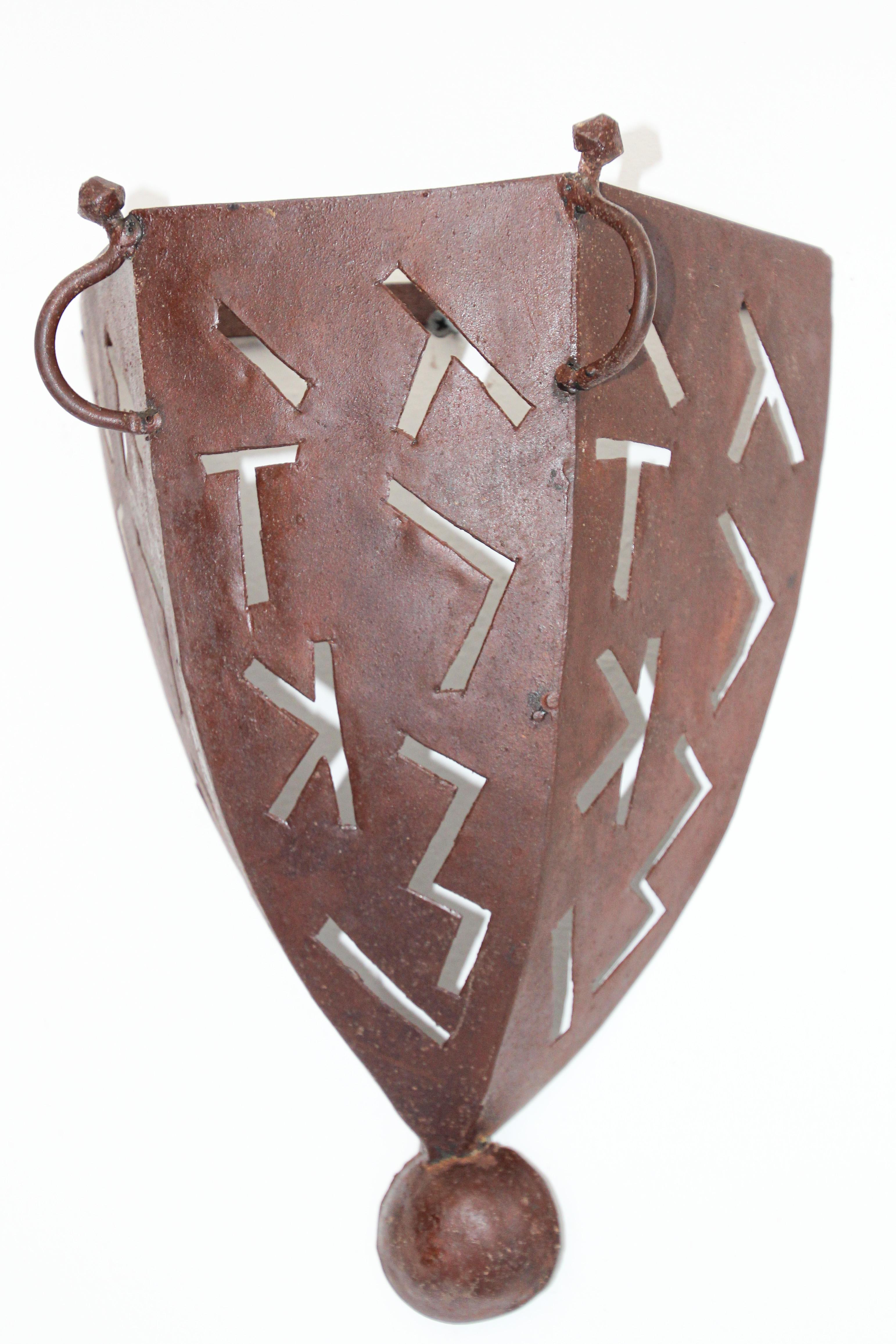 African Tribal Art wall shade metal sconce shade.
These Moroccan Art pieces could be used as wall lamp shade or just art work.
Iron frame with tribal handcut designs.
These lamp shades sit over your existing wall light fitting.
There are no