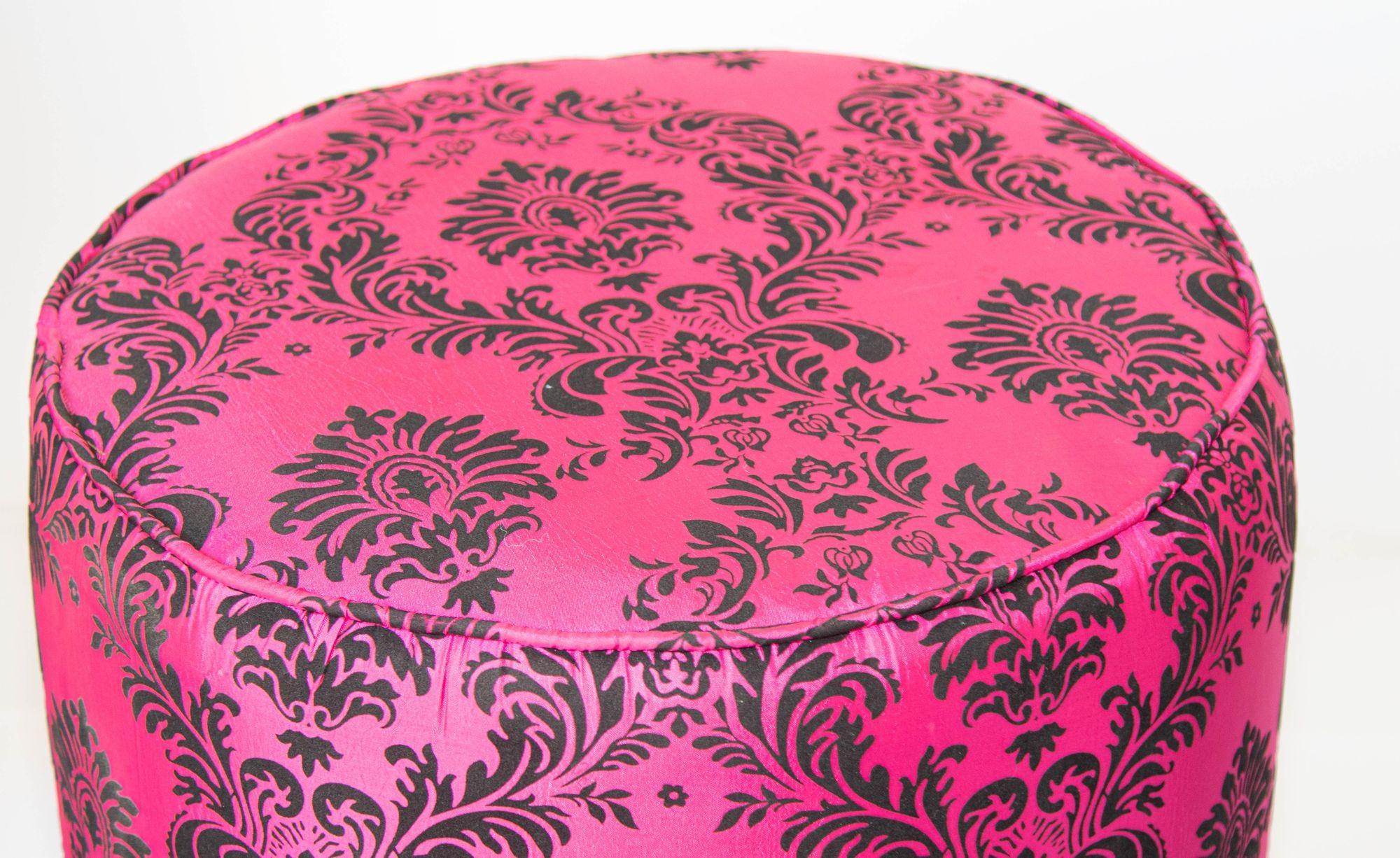 1960s Moroccan Art Deco Style Fuchsia and Black Velvet Pouf Ottoman  Boho Chic Vanity Stool
A bold and glamorous Moroccan round ottoman or vanity stool in vivid fuchsia pink with black velvet damask upholstery, featuring a raised floral taffeta