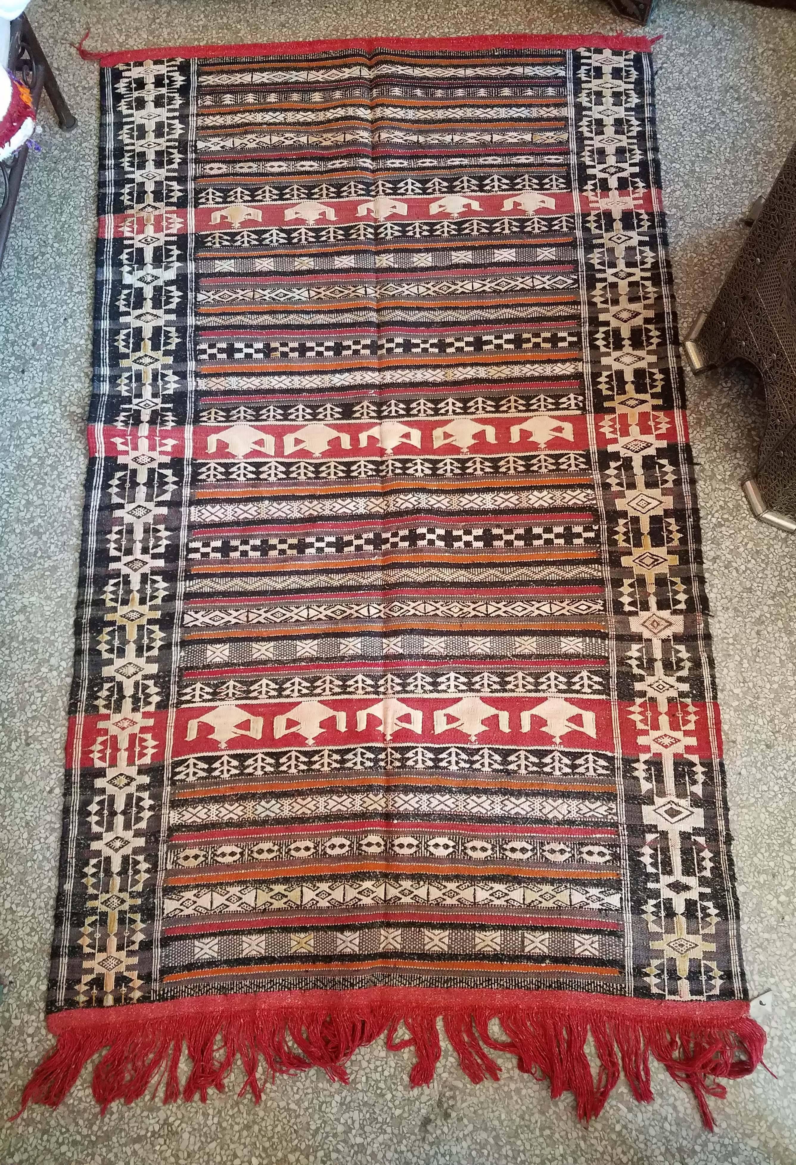Multi-color Moroccan Berber runner rug. Excellent handcraftsmanship. Priced to sell. Measuring approximately 70 inches long and 40 inches wide, this amazing rug comes from the Atlas mountains of Morocco. It would be a great addition to your home or