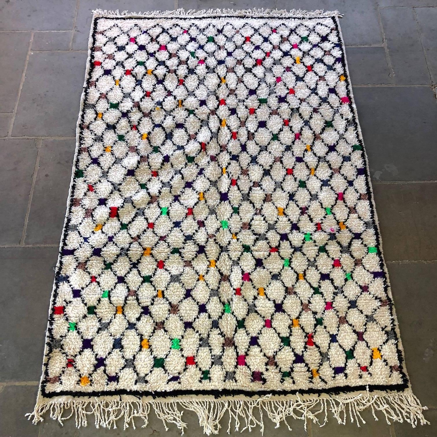 Beautiful Azilal rug from Morocco. Handcrafted from wool and cotton, no two of these are the same. Sourced from the villages of the Atlas Mountains, these rugs are vibrant and creative, an expression of modernism in folk art. They set off vintage