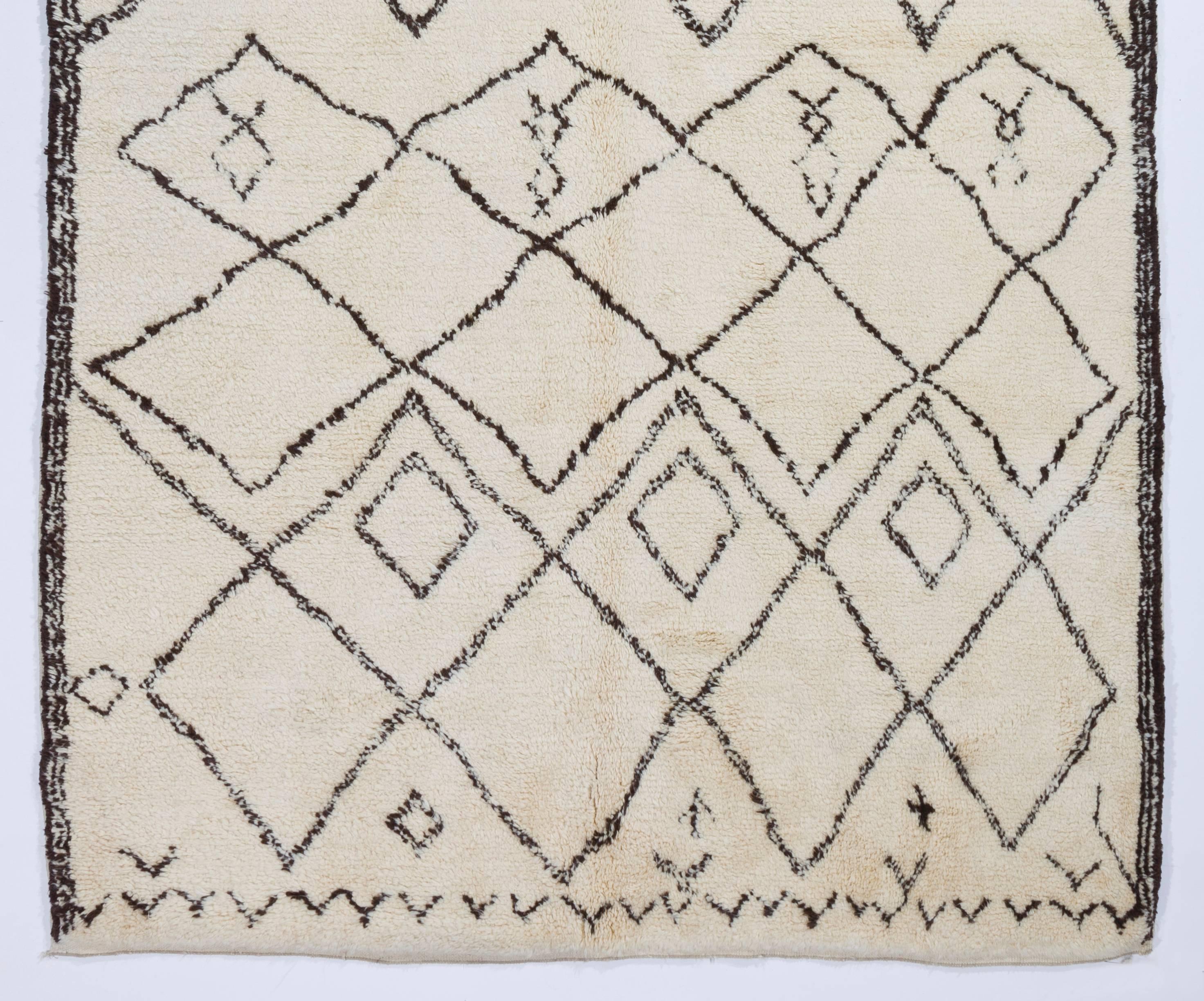 A brand new hand knotted contemporary Moroccan rug made of natural undyed, hand-spun sheep wool.

The rug is available as seen or if requested, it can be custom produced in a different size, color combination and design in 5-6 weeks.
