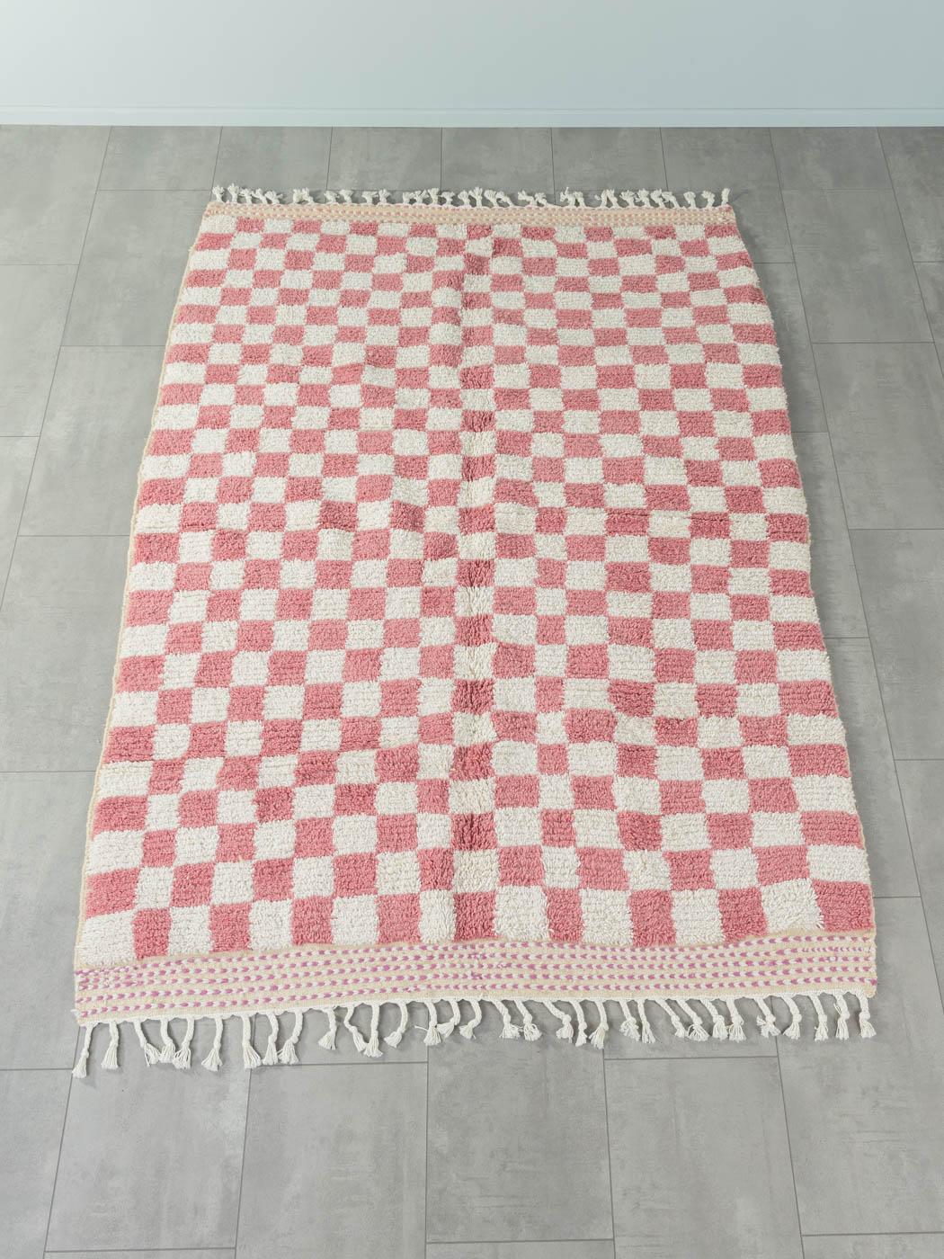 Pink Check is a contemporary 100% wool rug – thick and soft, comfortable underfoot. Our Berber rugs are handwoven and handknotted by Amazigh women in the Atlas Mountains. These communities have been crafting rugs for thousands of years. One knot at