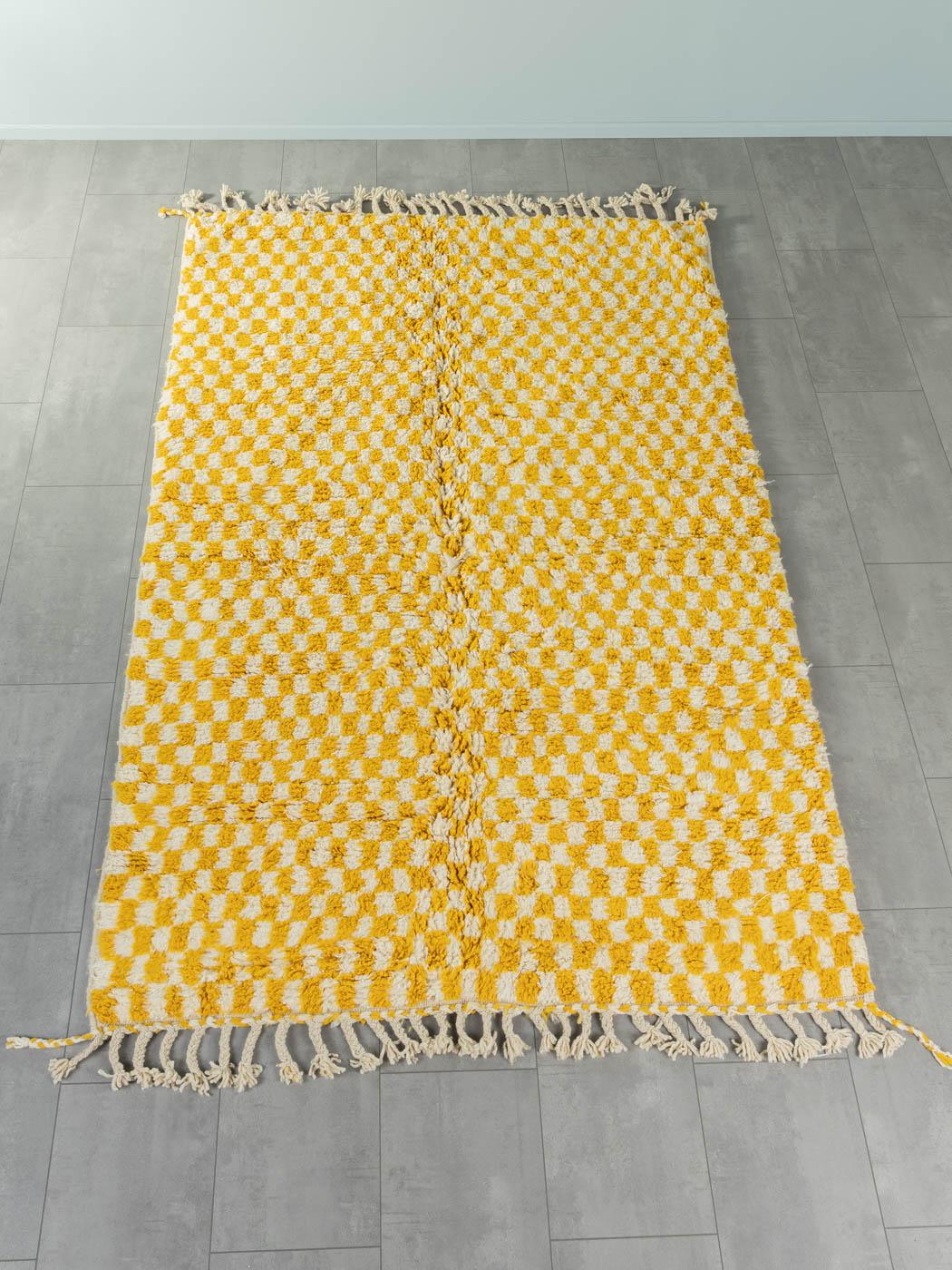 Tiny Lemon Check is a contemporary 100% wool rug – thick and soft, comfortable underfoot. Our Berber rugs are handwoven and handknotted by Amazigh women in the Atlas Mountains. These communities have been crafting rugs for thousands of years. One