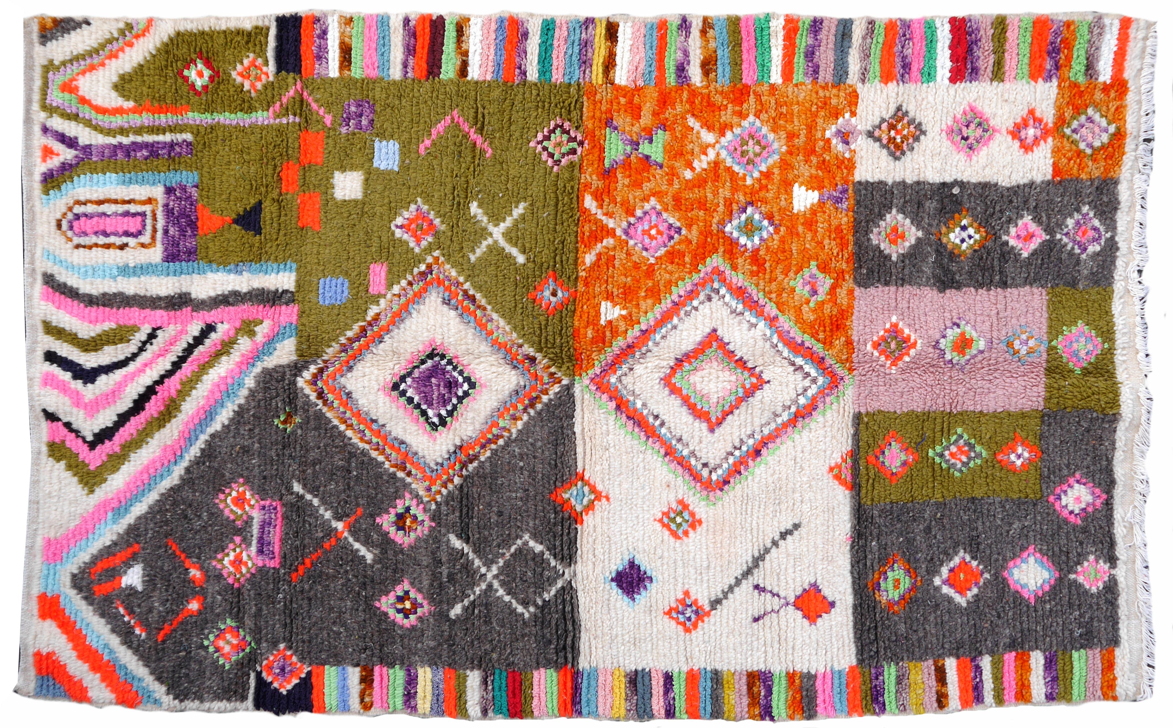 Berber rugs and carpets are mainly made in Morocco, Tunesia and Algeria. Largest producer are the tribal and nomadic Berber people of Morocco. Different areas produce very beautiful works of art. 

This rug was made in a village in the Atlas