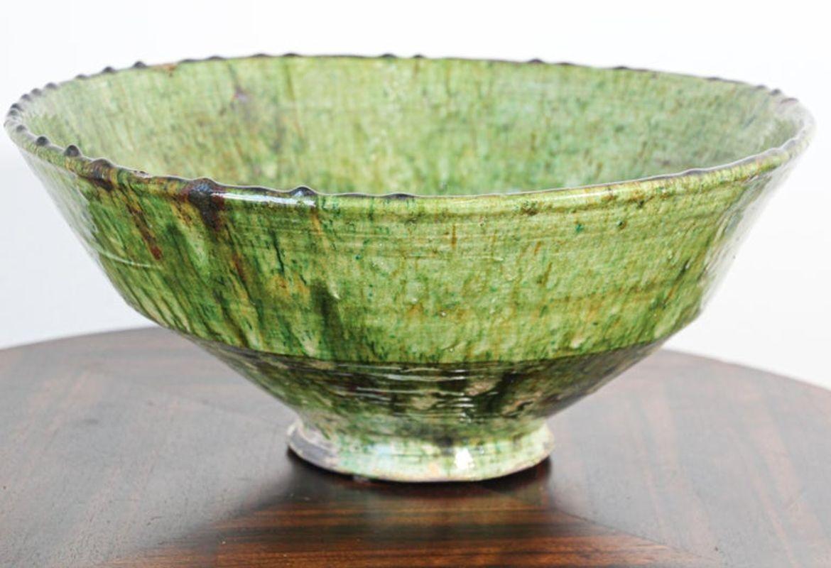 Large heavy Moroccan Tamgroute Tribal green terracotta glazed bowl.
Very large avocado green glazed earthenware bowl from Morocco.
Antique Moroccan Berber Tamgroute green glazed decorative terra cotta large decorative bowl.
Wonderful green and brown