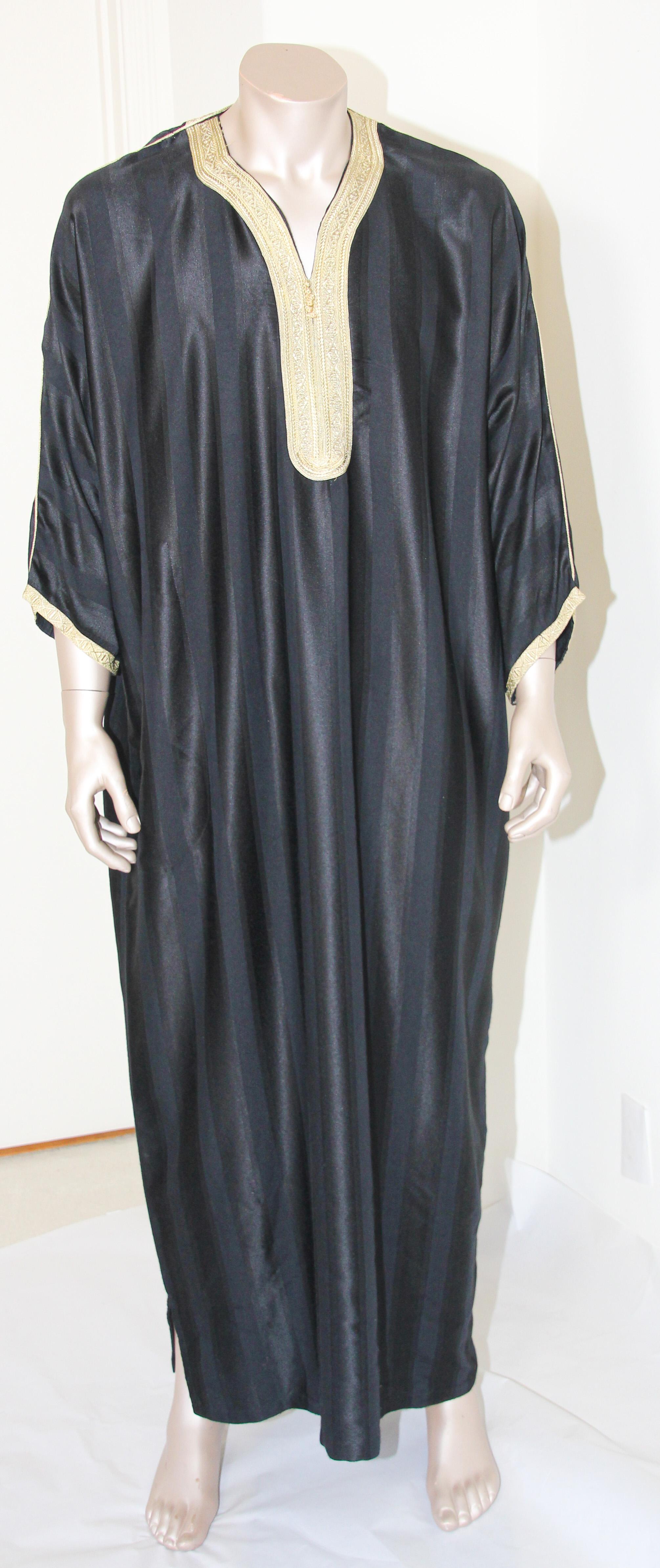 Moroccan gentleman vintage black caftan embellished with gold trim.
In Morocco, fashion preserves its traditional style inherited from great civilizations that found their way to Northwest Africa, such as the Ottomans and the Moors.
Moroccan