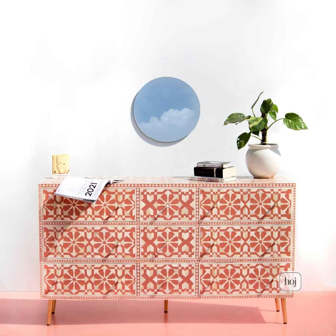Elevate your interior with this exquisitely handcrafted Moroccan Bone Inlay nine drawer dresser, a stunning fusion of traditional artistry and modern luxury. Designed and made by master artisans in India, this dresser features an intricate mosaic