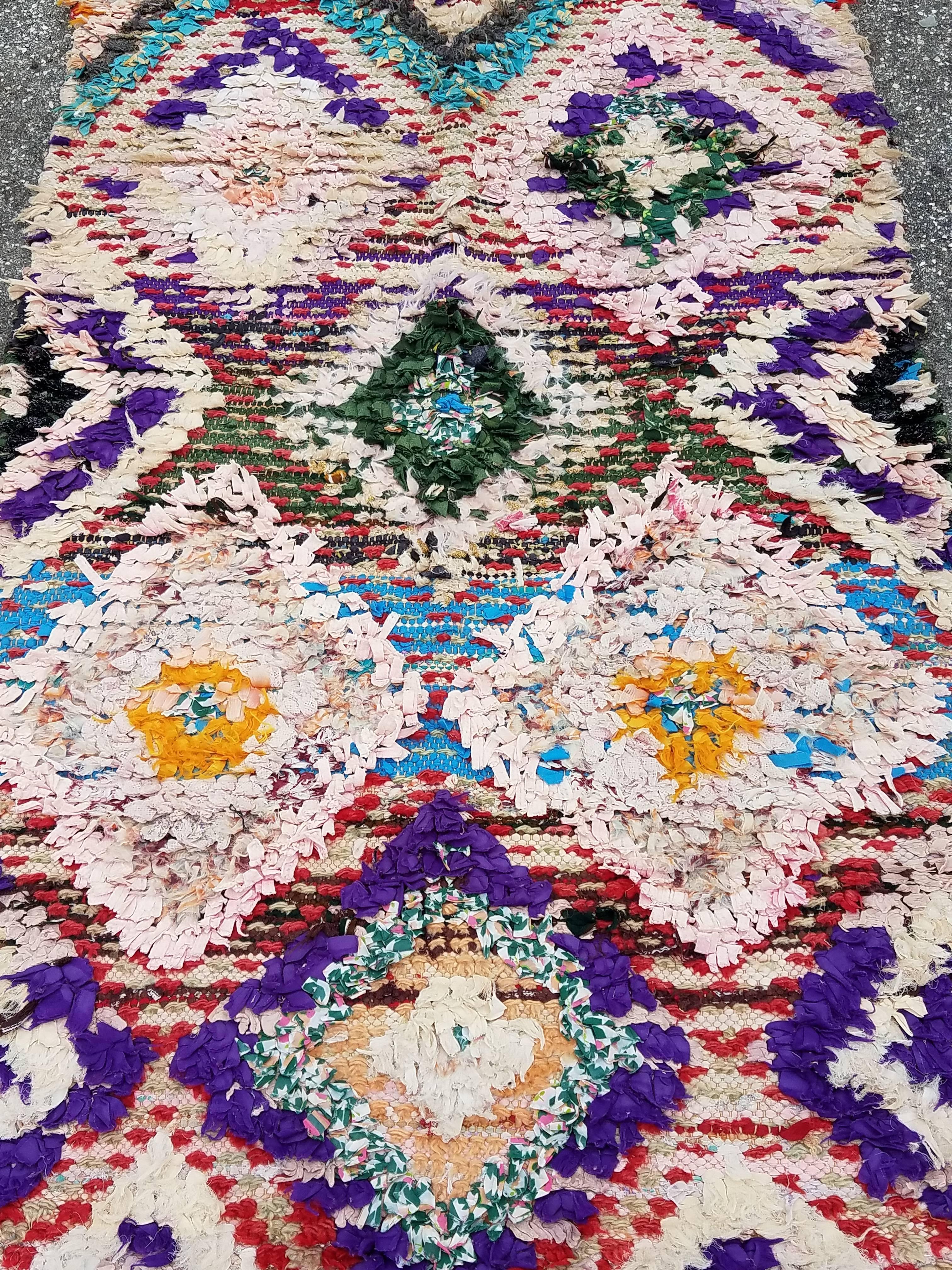 Beautiful Moroccan Boucherouite rug made in Marrakech . Excellent handcraftsmanship. Priced to sell. Measuring approximately 97 inches long and 34 inches wide, this amazing rug from the Atlas mountains of Morocco will be a great addition to your