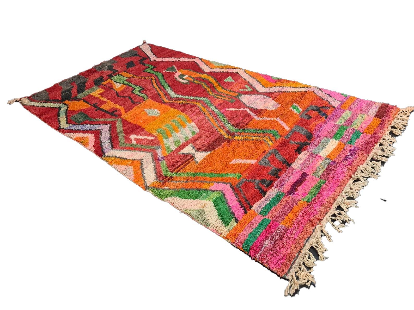 Moroccan Boujaad rug handwoven out of natural and soft sheep wool featuring multicolored geometric design.

Width: 5.5 ft
Length: 9.5 ft