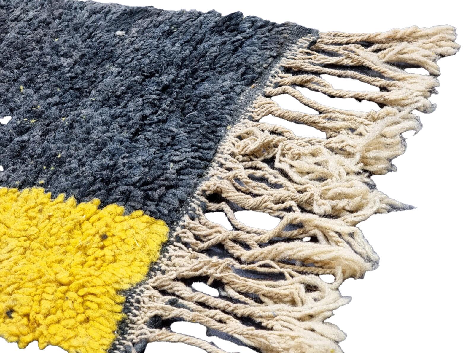 Moroccan Boujaad rug in white and black striped wool handwoven high in the Atlas mountains by the Ben Ourain tribe using techniques handed down generation to generation. Every handmade rug is washed and dried in the mountain air and made with the