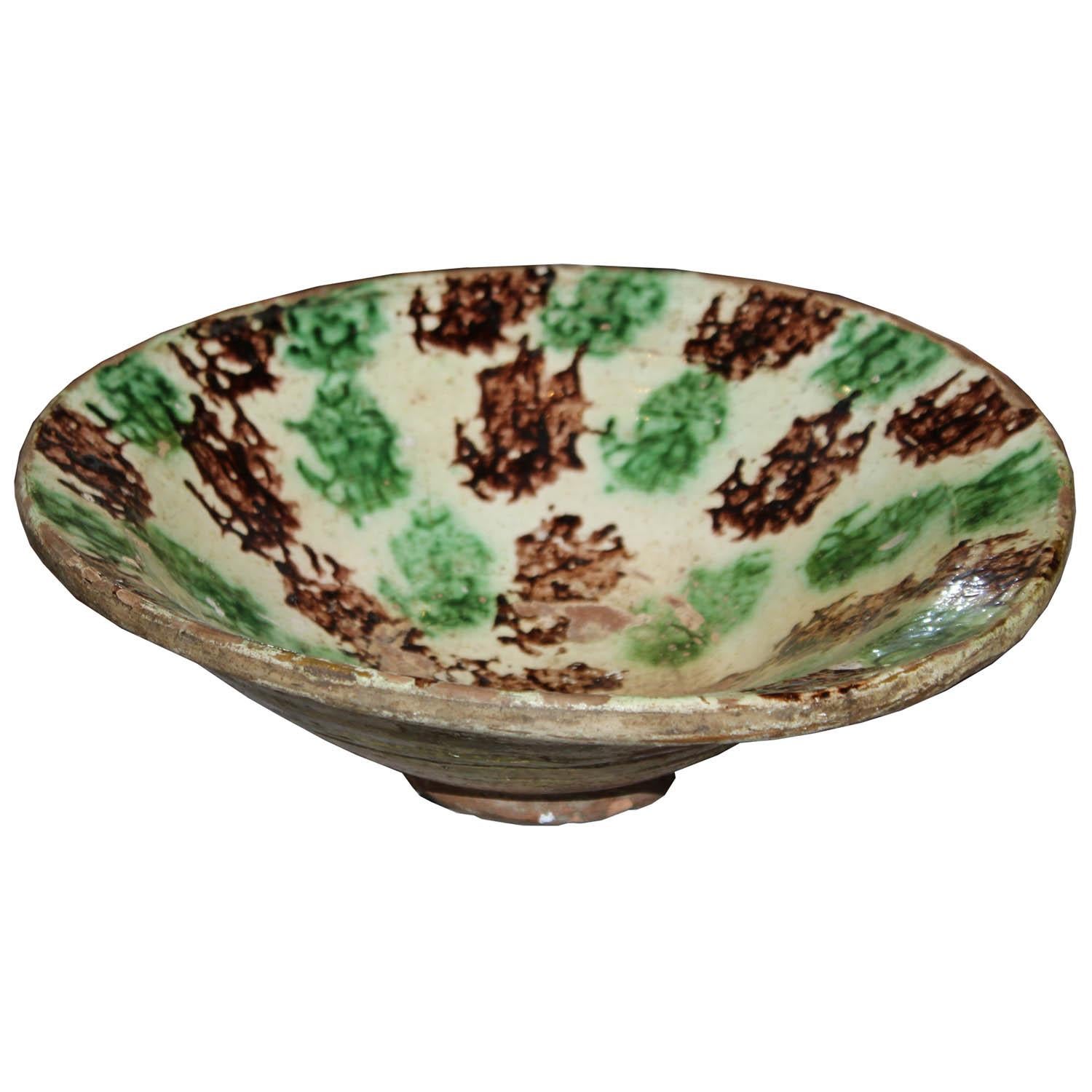 Vintage green and brown glazed ceramic bowl originally used for food would be a nice accessory on a coffee table or on a bookshelf.
 
   