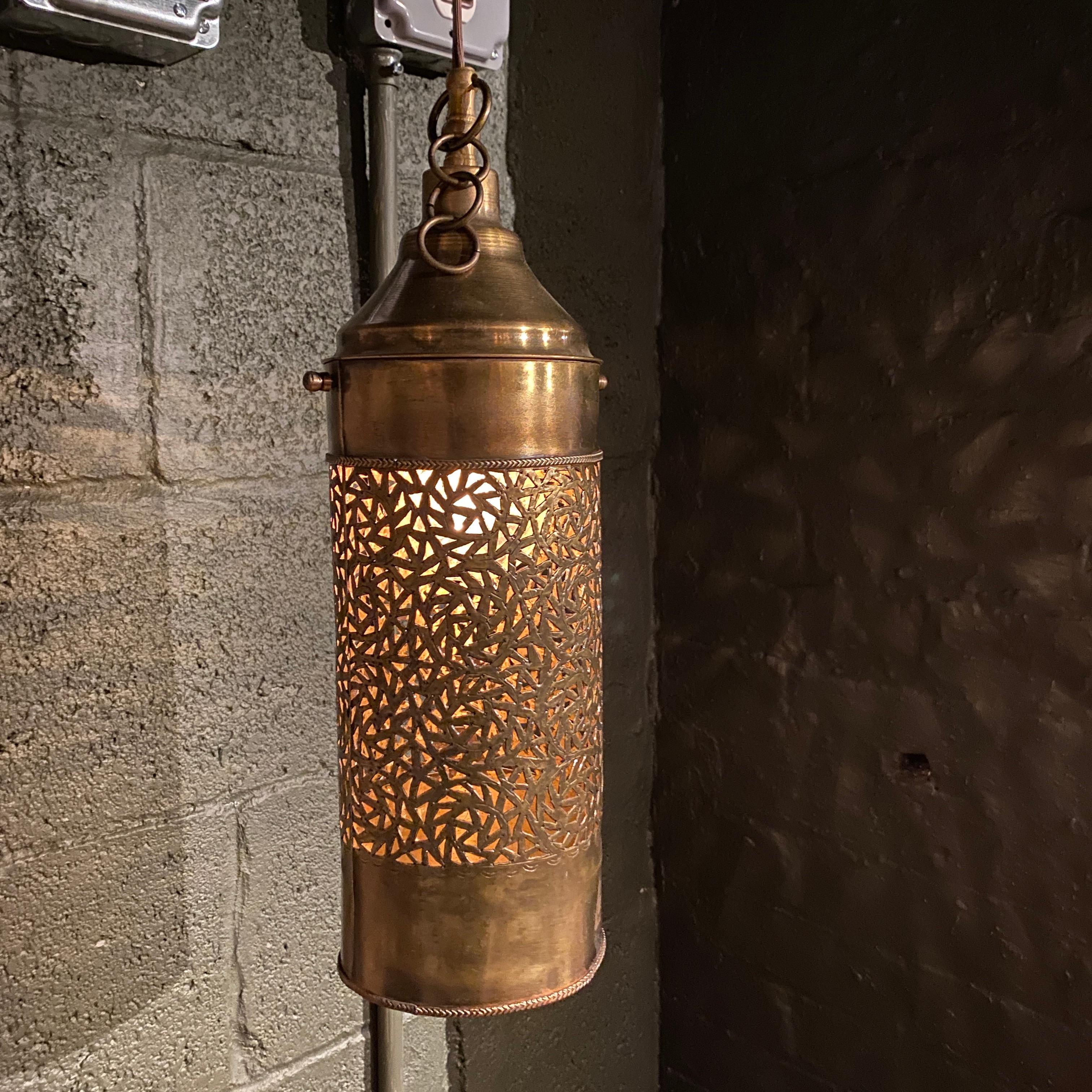 This brass pendant displays beautifully carved design on the body. When lit, it illuminates the design even more drawing your attention. This piece pays close attention to detail and will be the talk of every guest who comes in contact with it.