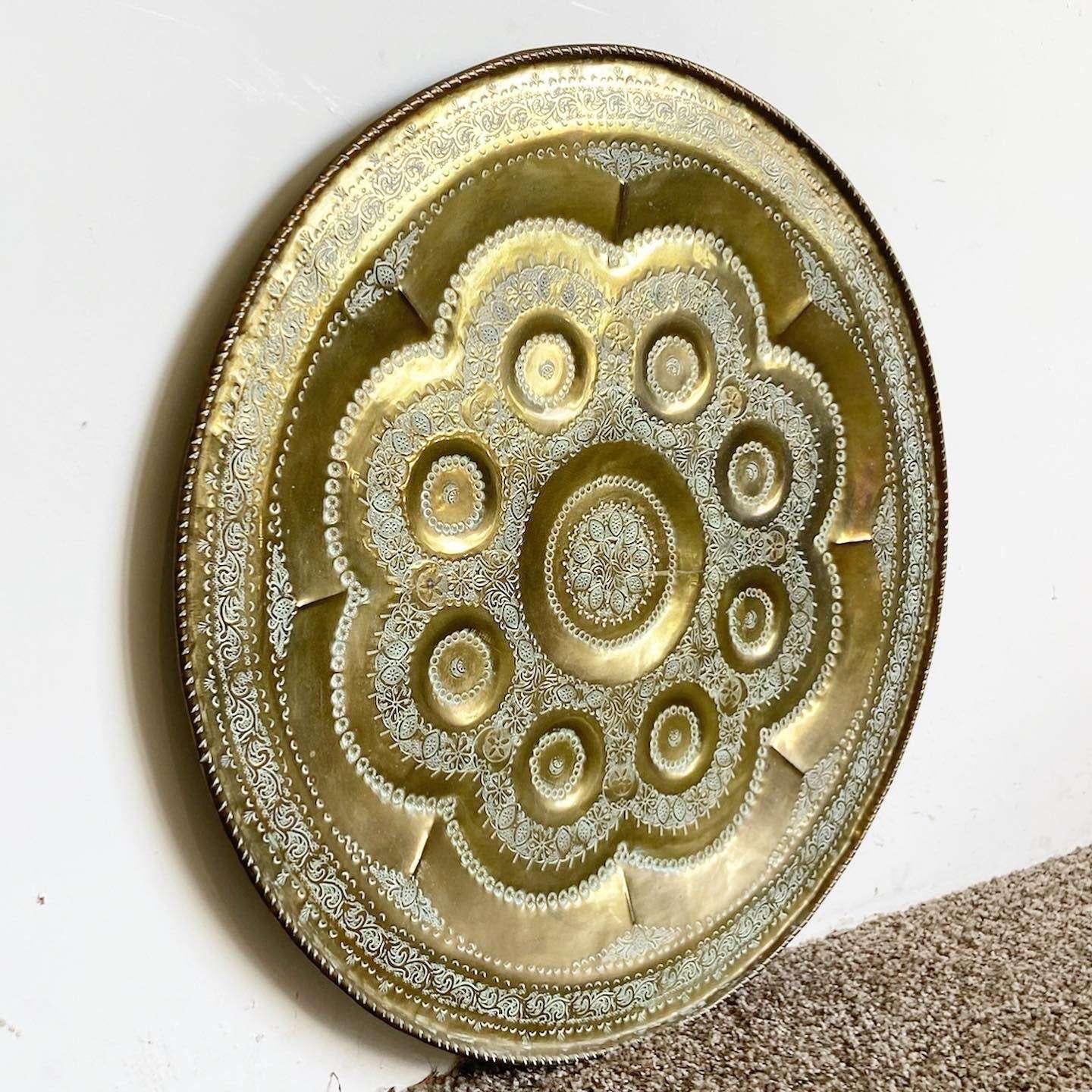 Wonderful vintage Moroccan brass serving platter. Features ornate hand crafted designs.
