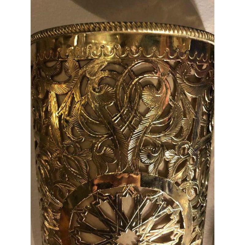 Moroccan gold toned brass wall lanterns or sconces
The exquisite filigree work of this handcrafted brass wall lanterns will elevate the ambiance of any room. Featuring an exotic design motif, this wall-mounted sconce emits a soft, filtered light.