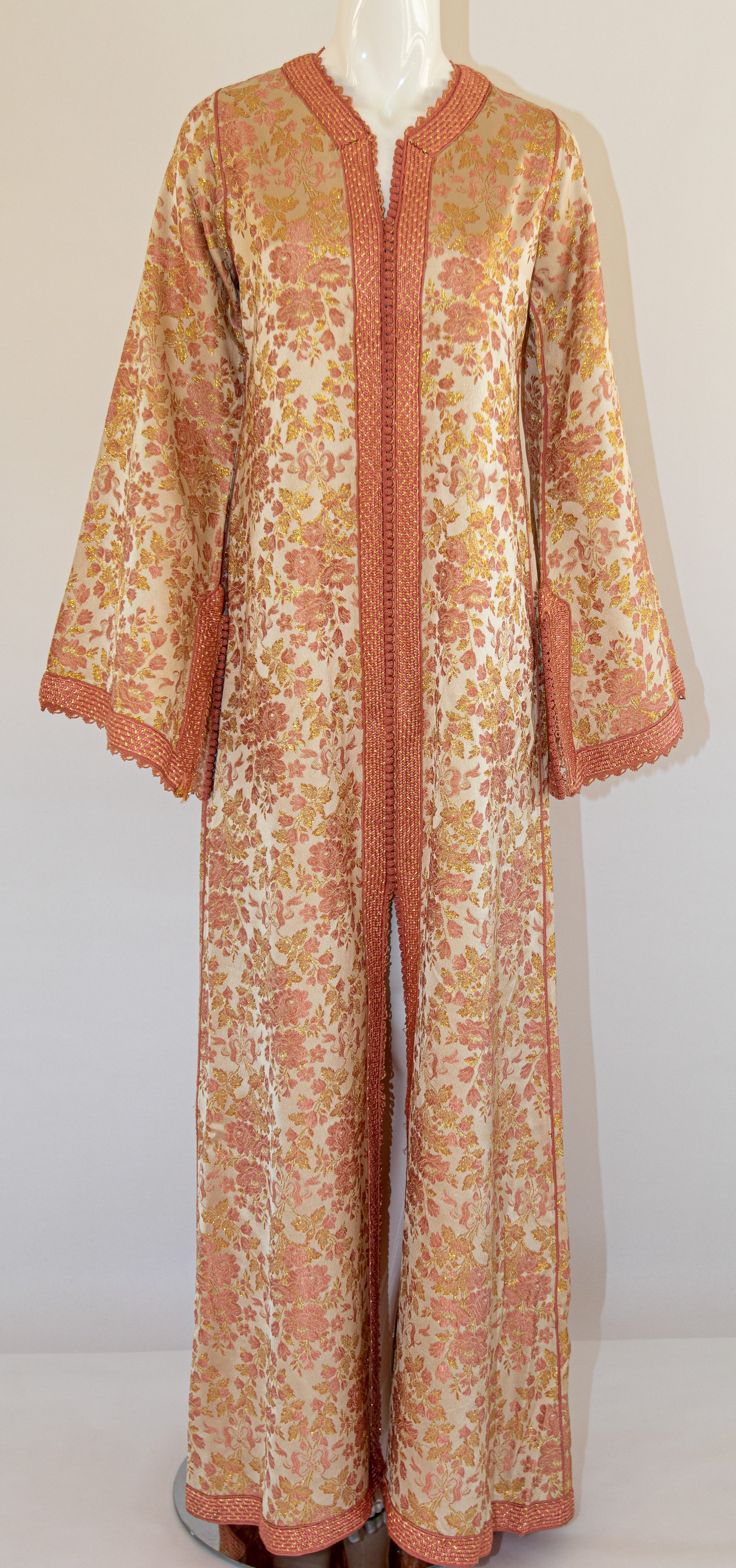 Elegant Moroccan caftan pink, peach and gold damask gorgeous vintage hostess gown.
 Floral multi-colored damask Kaftan circa 1970s.
Exotic oriental floral long maxi caftan dress with long sleeves in shimmering brocade pink and gold fabric.
This long