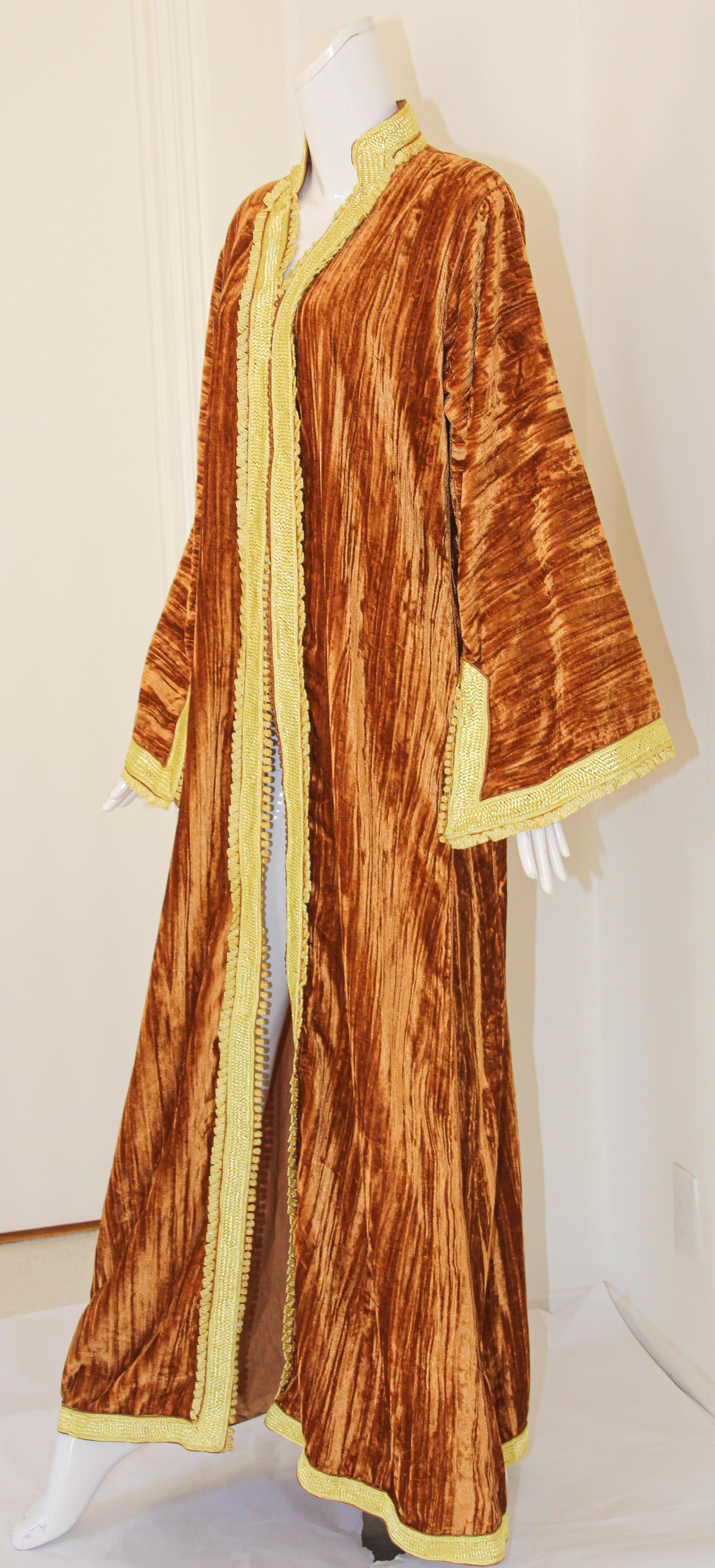 Amazing vintage Moroccan handmade caftan in caramel color crushed silk velvet heavily with gold rim threads. 
Circa 1960's.
The honey gold velvet Moorish kaftan maxi dress is embroidered and embellished entirely by hand, super-luxe designer kaftan.