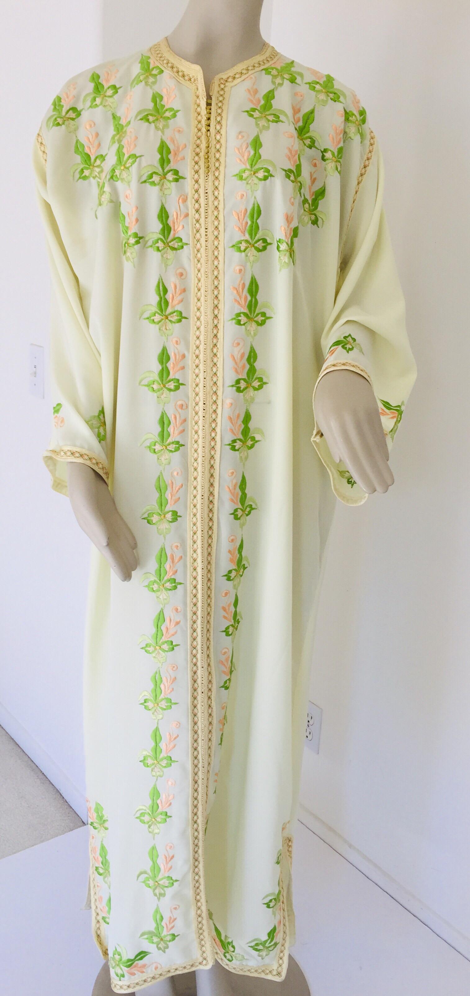 Elegant Moroccan caftan with trim embroidered, yellow, green, pink gold.
This light summery caftan is crafted in Morocco and tailored for a relaxed fit, features a traditional neckline, embellished sleeves and vented sides.
This long maxi dress