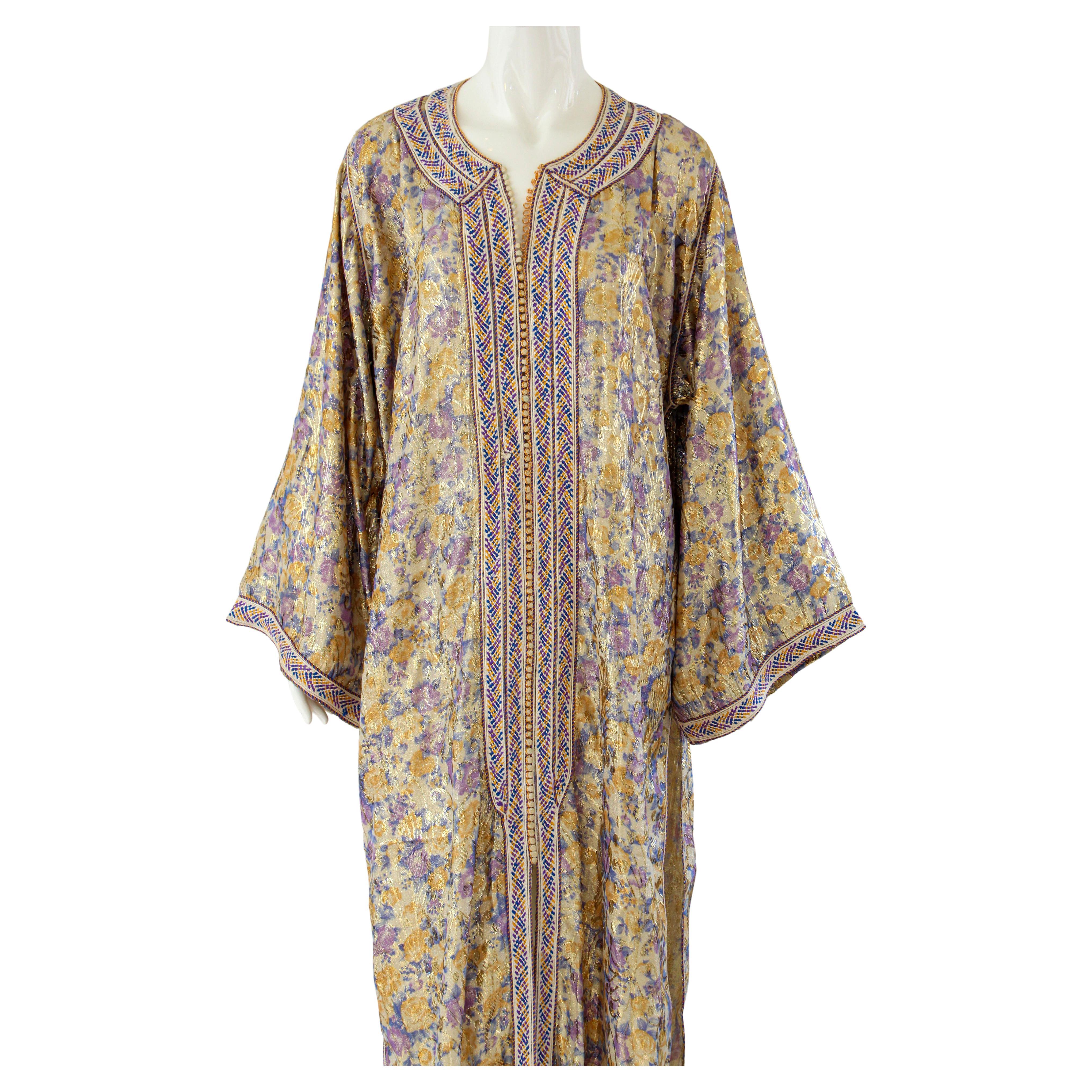 Elegant Moroccan caftan metallic silk floral brocade, purple and gold.
circa 1970s.
This light summery caftan is crafted in Morocco and tailored for a relaxed fit, features a traditional neckline, embellished sleeves and vented sides.
This long maxi