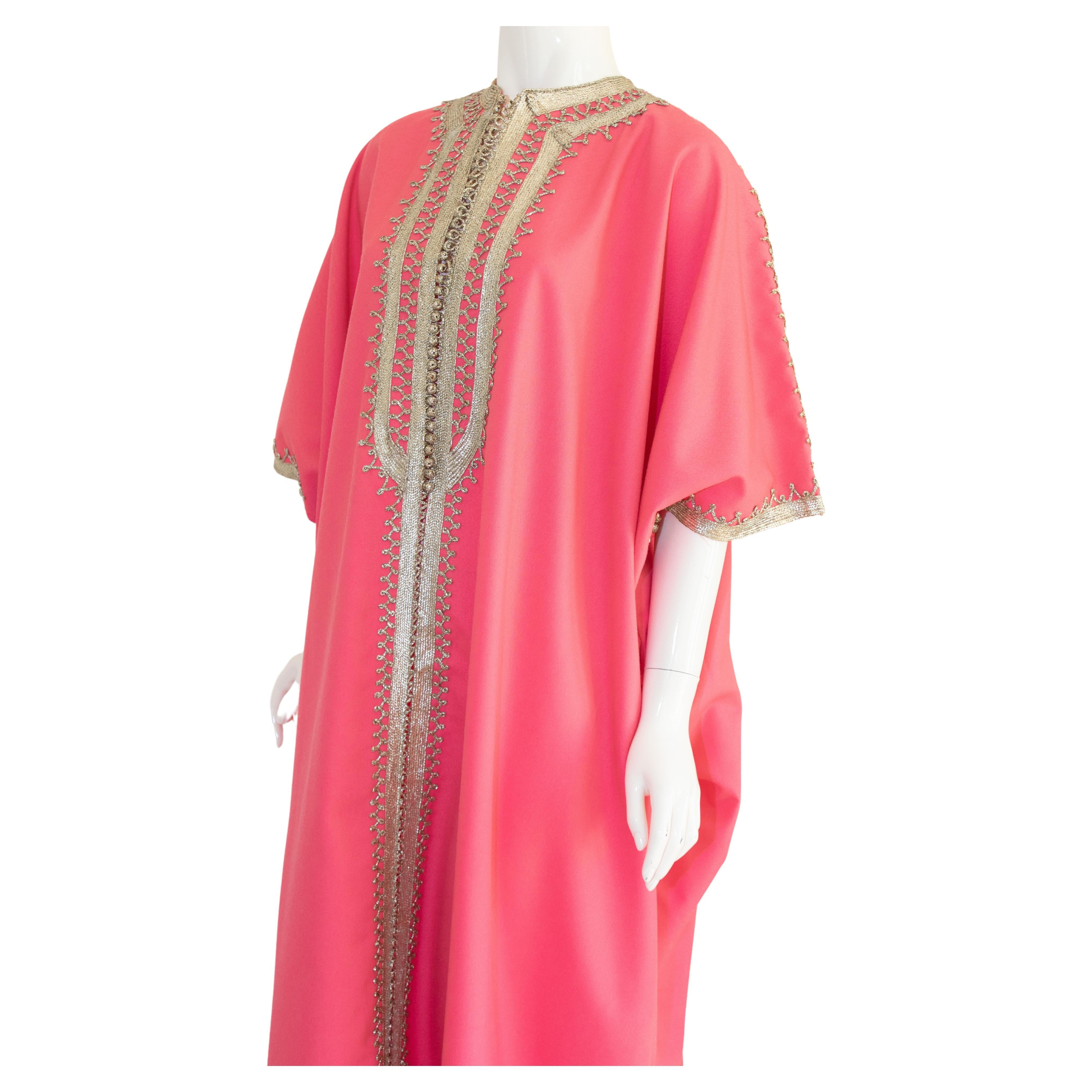 Elegant Moroccan caftan hot pink color embroidered with silver metallic threads, circa 1970s. 
This long maxi poly jersey dress kaftan is embroidered and embellished with traditional designs in silver.
One of a kind evening vintage Moroccan Middle