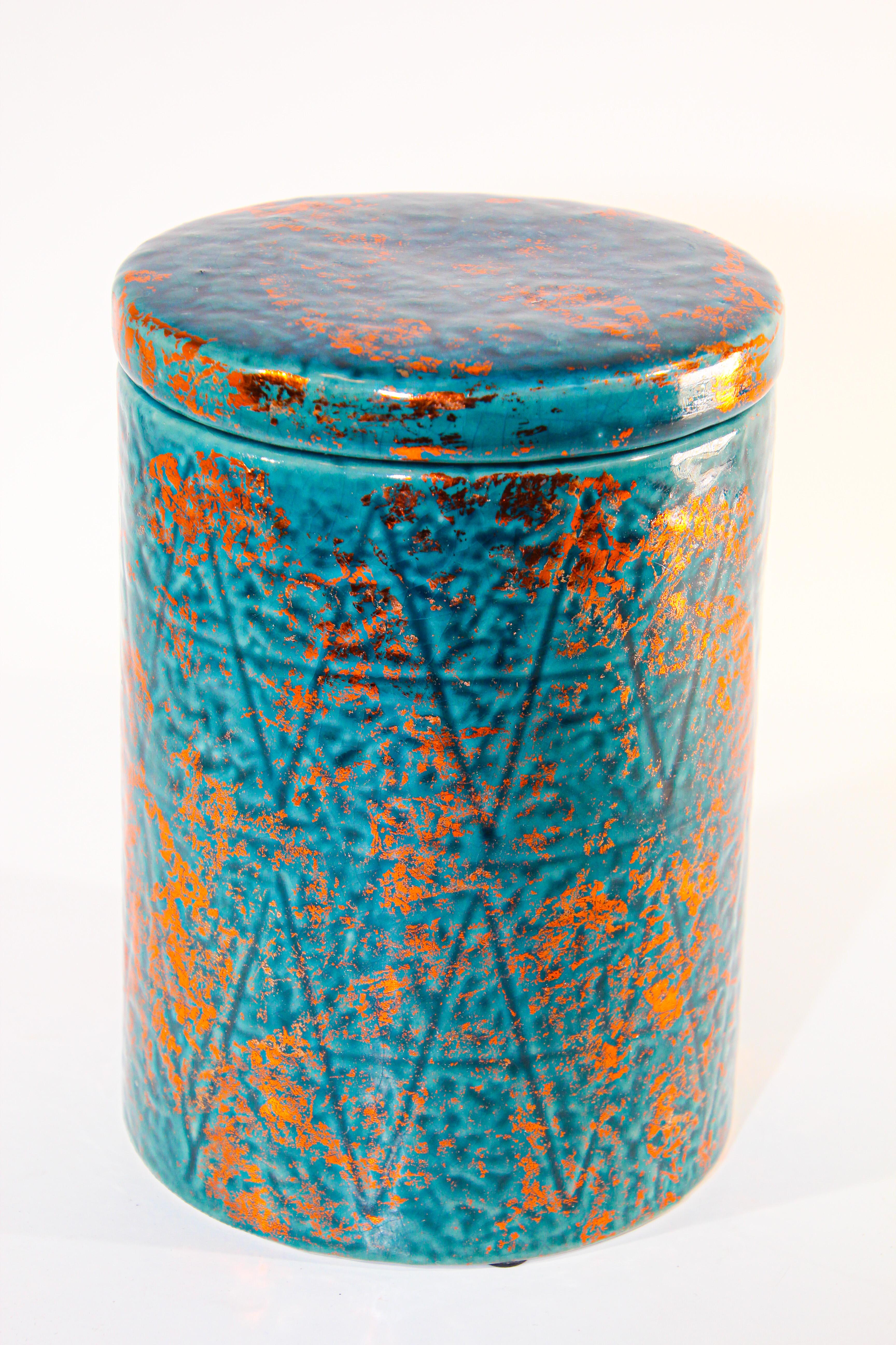 Moroccan ceramic urn with lid, blue with copper color.
Modern form with clean lines, textured design.
Great to use in the kitchen or in the bathroom or anywhere with any style, Bohemian, Moorish, Vintage, Traditional or Modern.
Great Folk Art