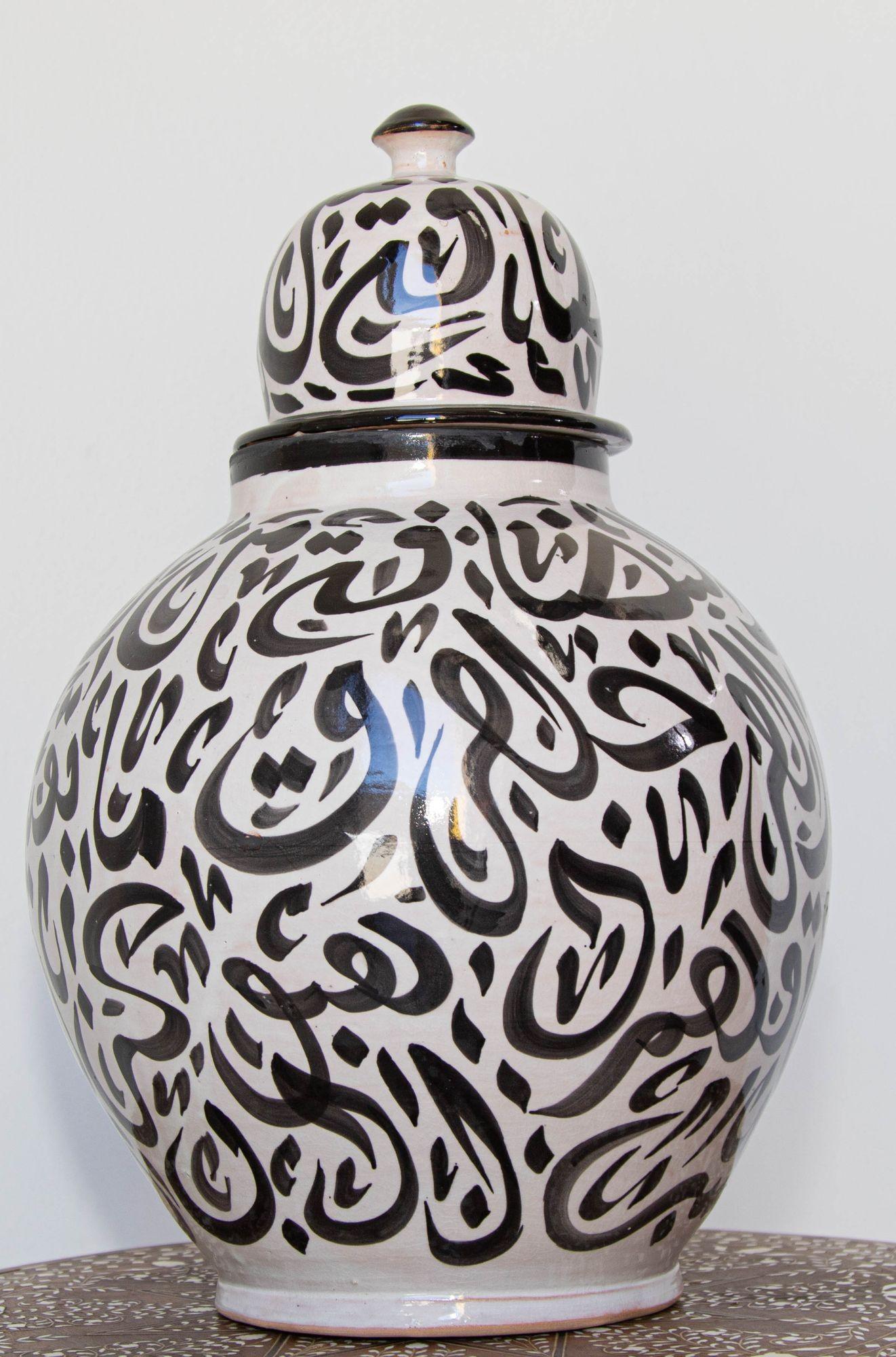 white pottery with black writing