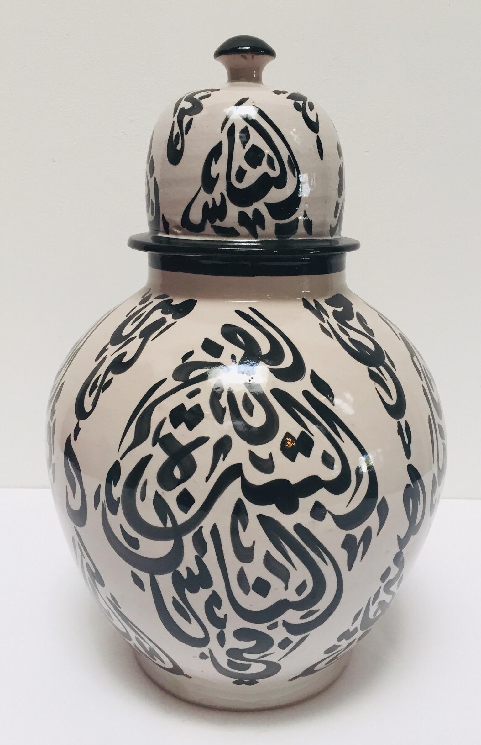 white pottery with black writing