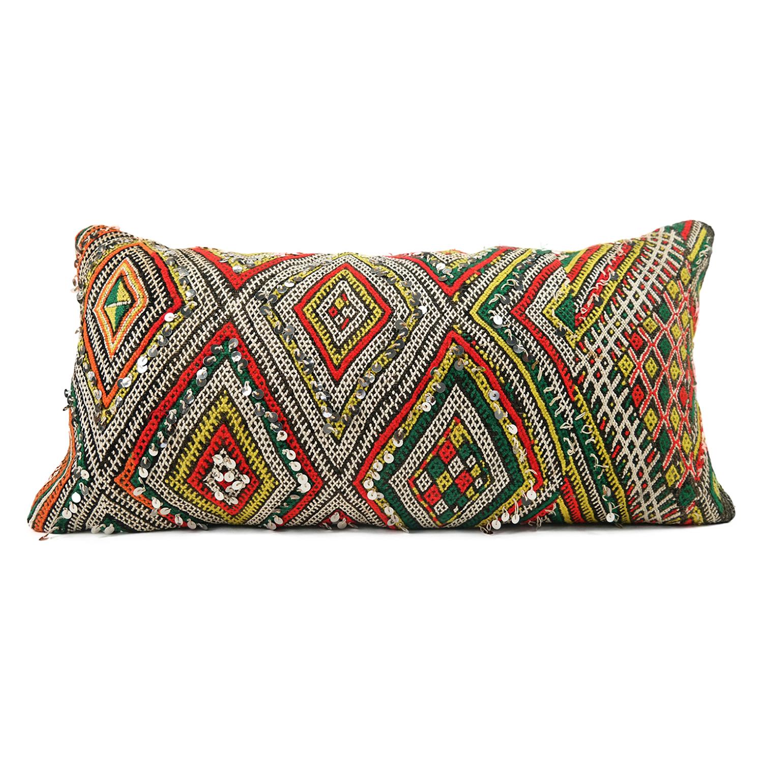 A stunning extra large bohemian Moroccan Kilim cushion custom made in Morocco. Cut from a circa 40 years old hand loomed Kilim rug, from the Middle Atlas Mountains. We have searched and selected the rug ourselves. The pillow has beautiful colors