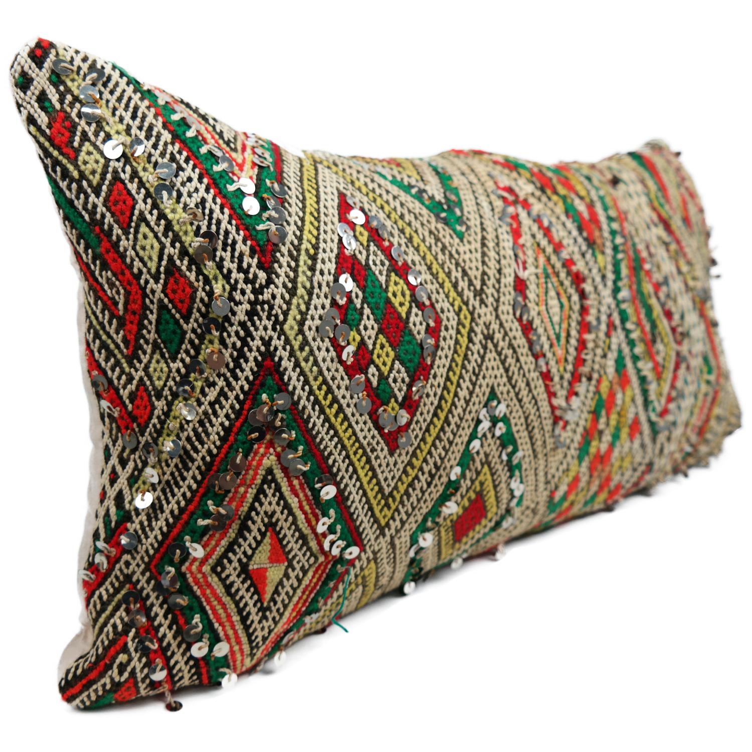 A stunning extra large Bohemian Moroccan Kilim cushion custom made in Morocco. Cut from a circa 40 years old hand loomed Kilim rug, from the Middle Atlas Mountains. We have searched and selected the rug ourselves. The pillow has beautiful colors