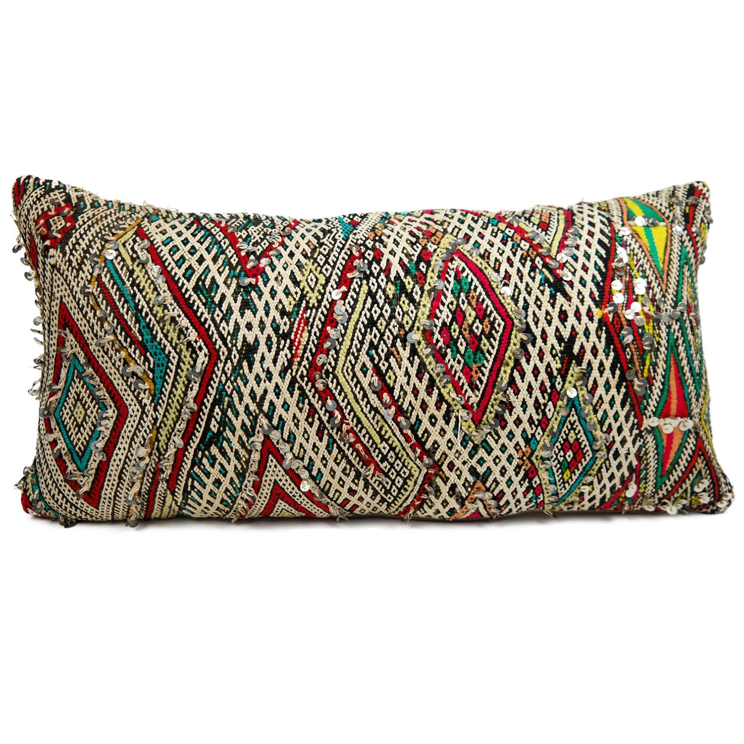 A stunning extra large Bohemian Moroccan Kilim cushion custom made in Morocco. Cut from a circa 40 years old hand loomed Kilim rug, from the Middle Atlas Mountains. We have searched and selected the rug ourselves. The pillow has beautiful colors