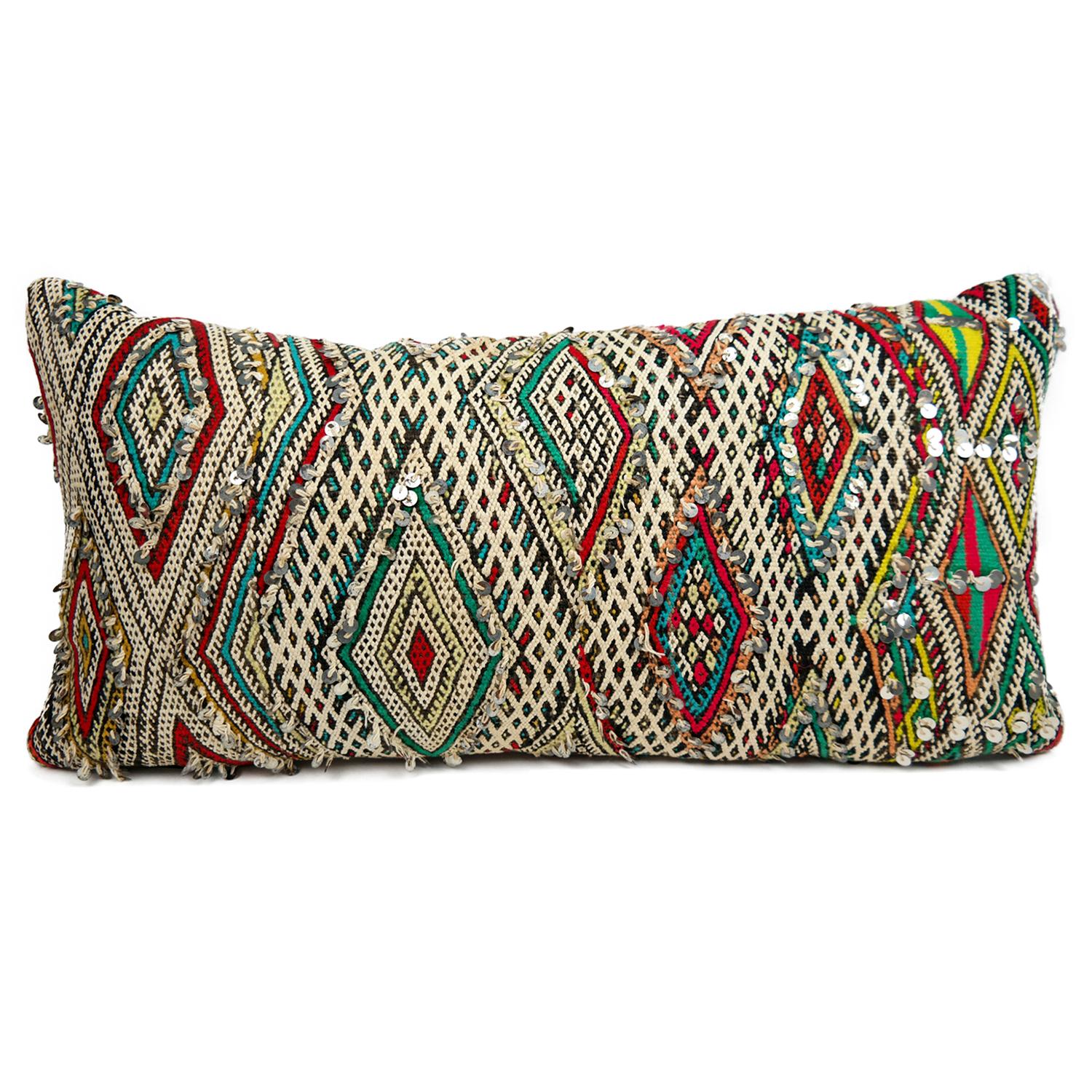 A stunning extra large bohemian Moroccan kilim cushion custom made in Morocco. Cut from a circa 40 years old hand loomed kilim rug, from the Middle Atlas Mountains. We have searched and selected the rug ourselves. The pillow has beautiful colors