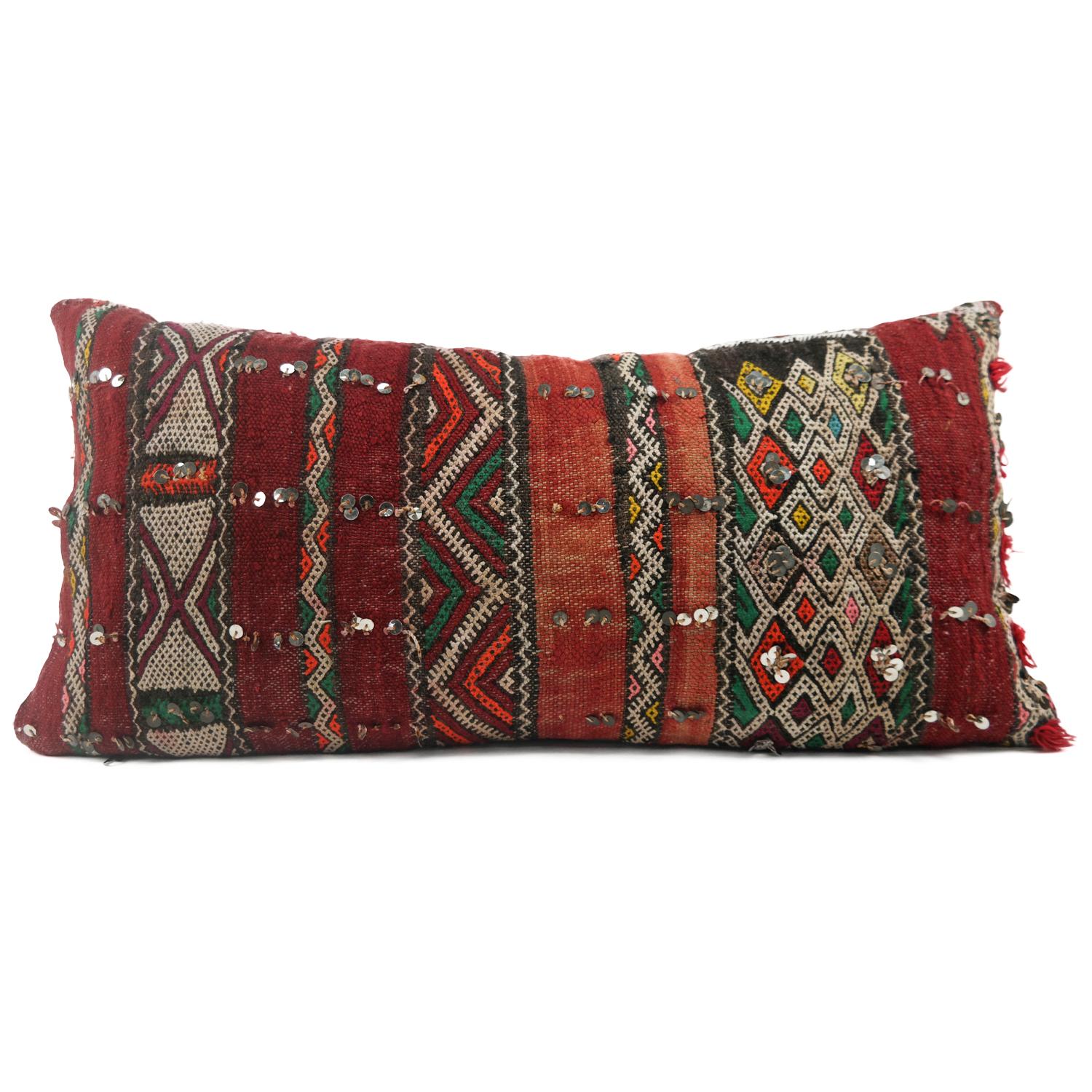 A stunning extra large Bohemian Moroccan Kilim cushion custom made in Morocco. Cut from a circa 40 years old hand loomed Kilim rug, from the Middle Atlas Mountains. We have searched and selected the rug ourselves. The pillow has beautiful colors